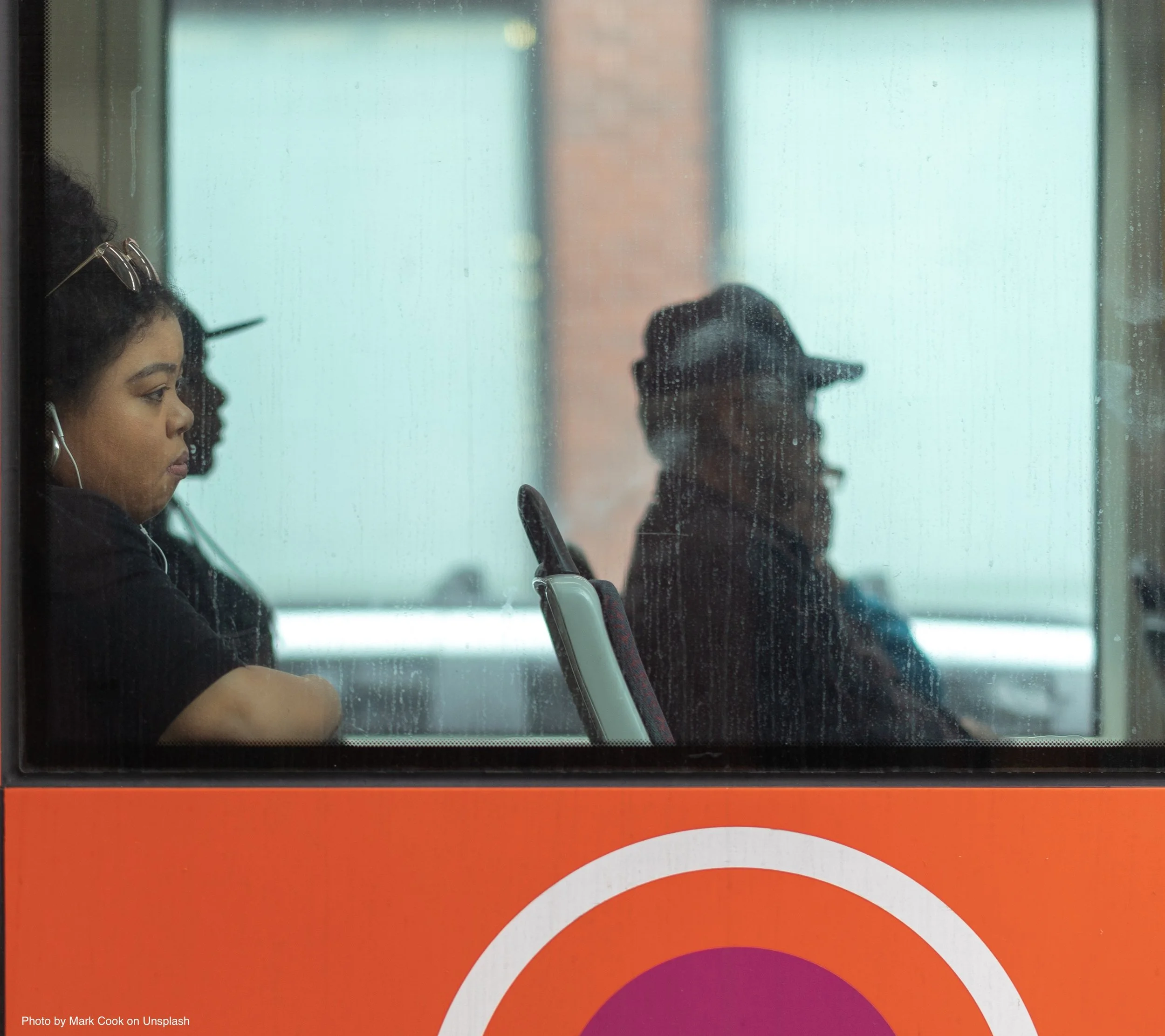 Woman with earbuds on bus.jpg