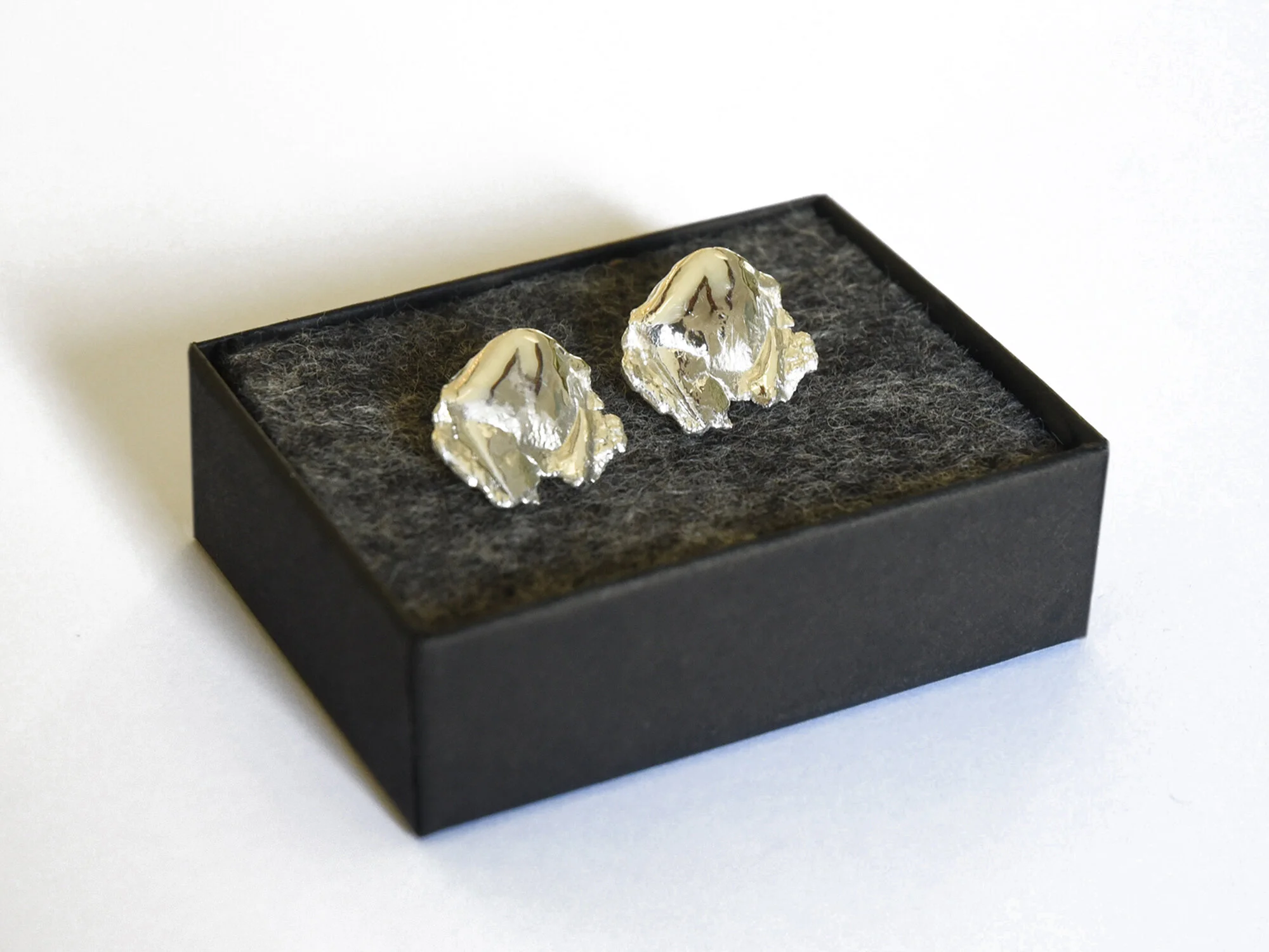 silver earrings unique design handmade textured sculptural artisan craftsmanship modern statement small