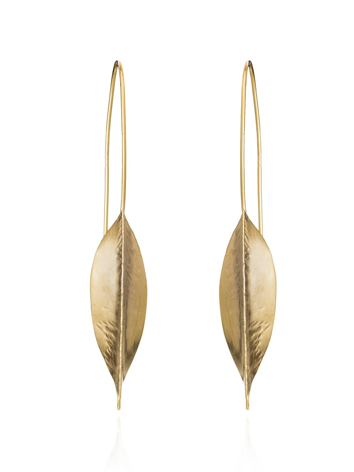 Sofie earrings handmade by Lucy Behrens in silver or gold, delicate scored leaves