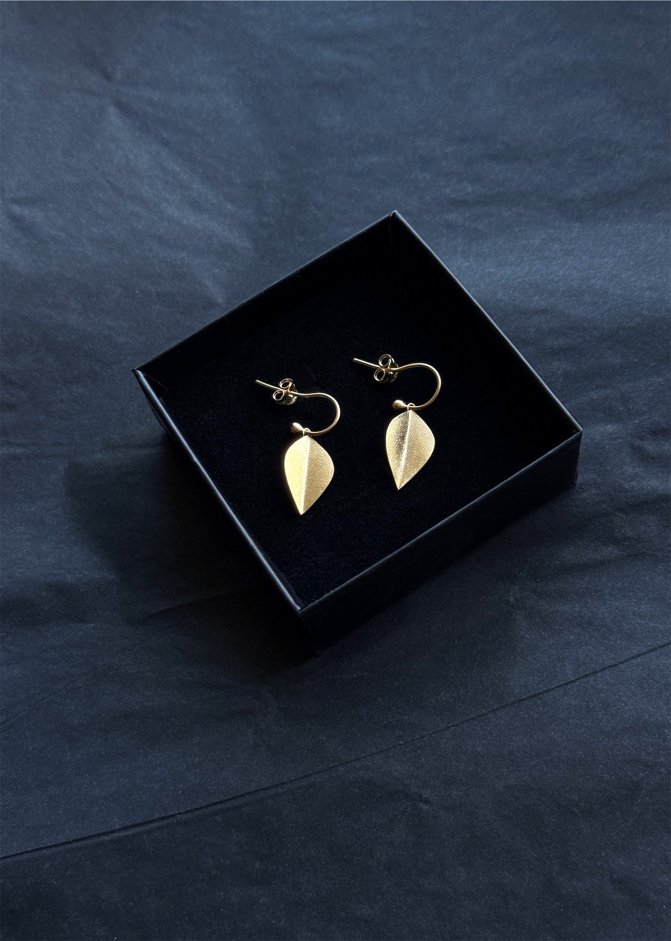 minimalist handmade leaves leaf earrings gold simple hoop handmade devon artisan jewellery jeweller