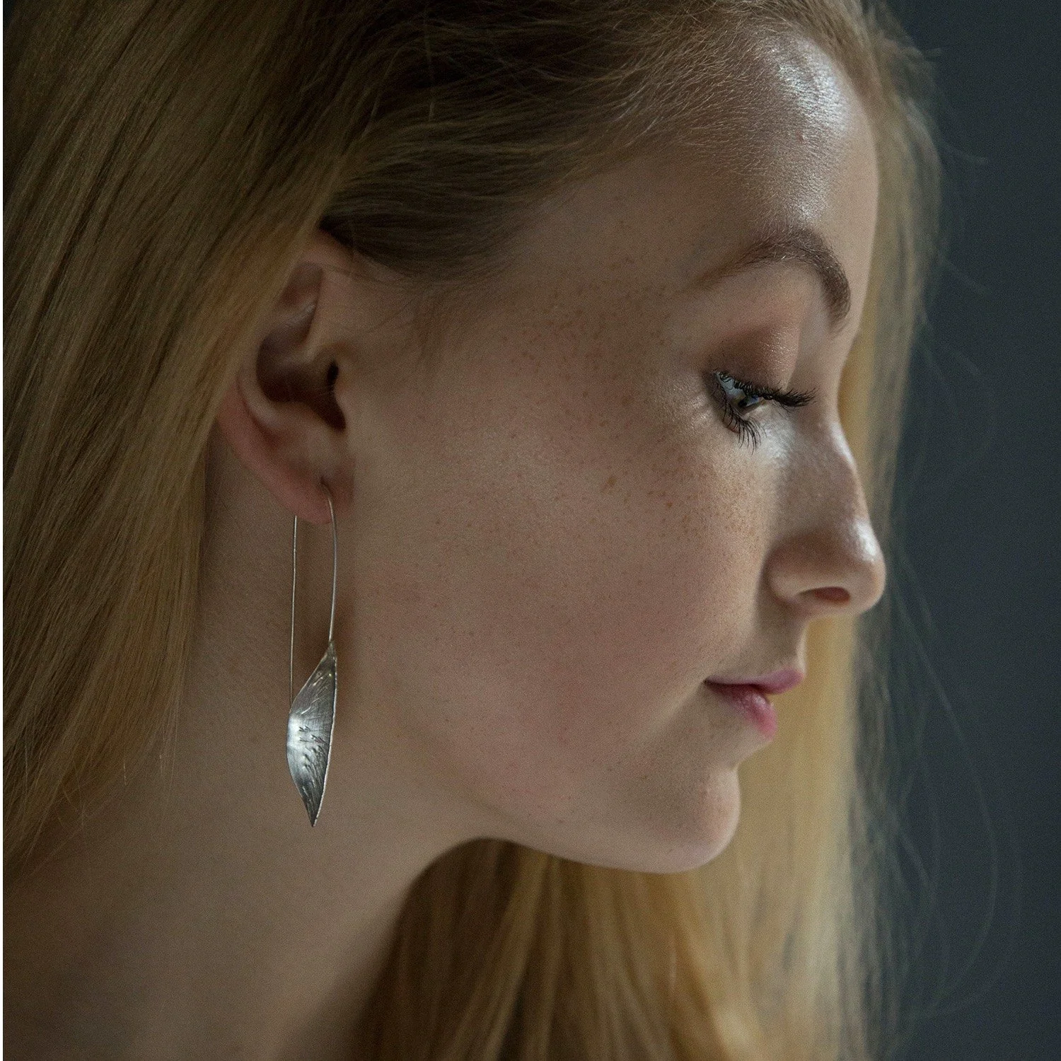 Sofie earrings handmade by Lucy Behrens in silver or gold, delicate scored leaves