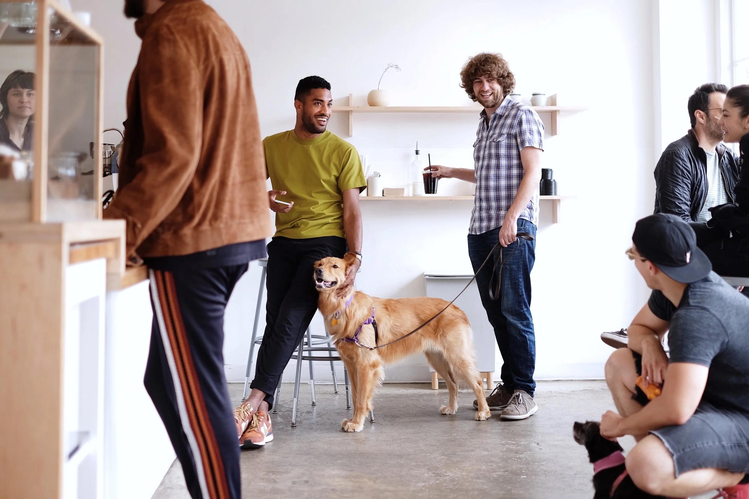 A typical weekend at Maru— neighbors, caffeine, and puppies.