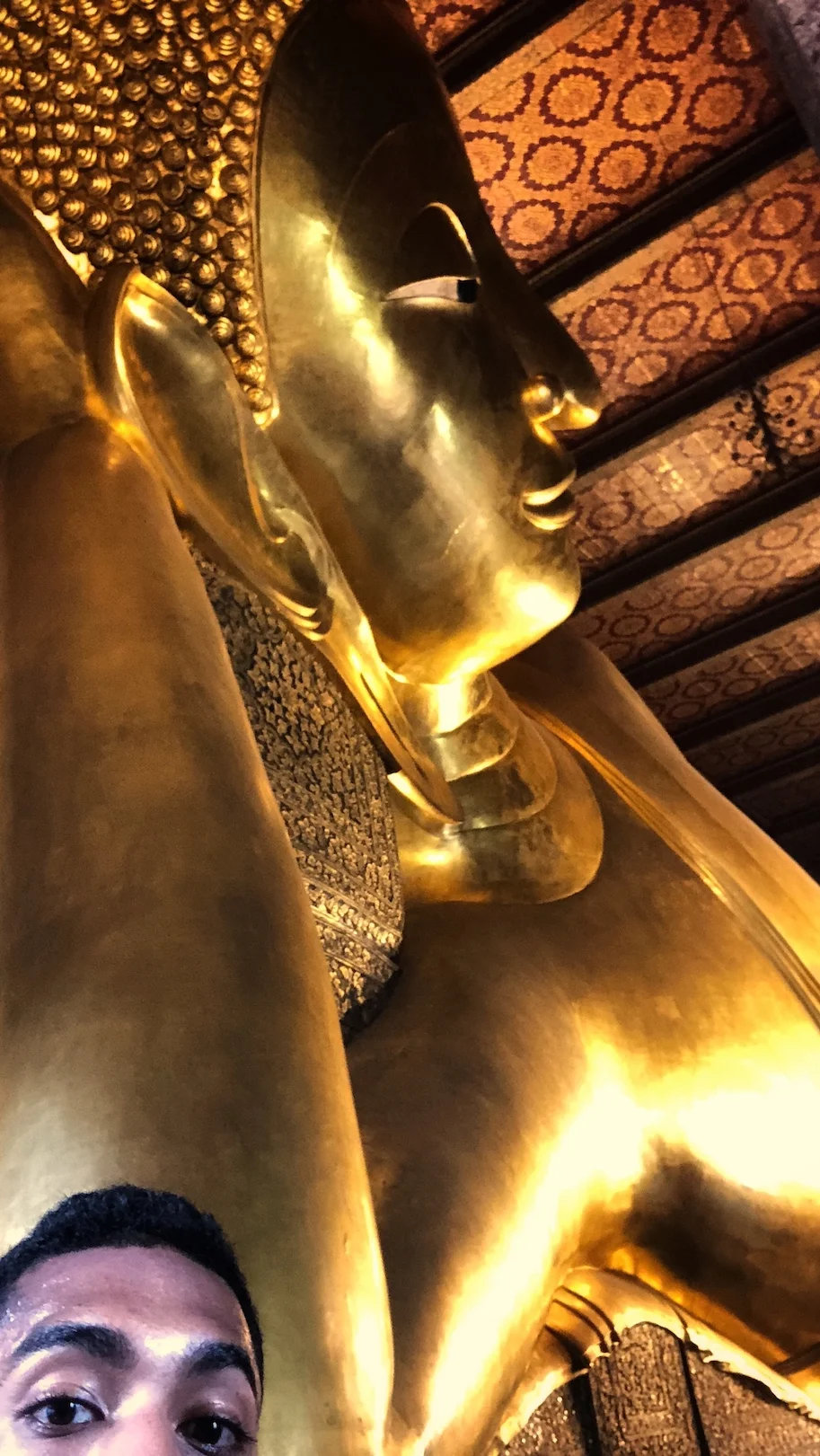 The reclining buddha at Wat Pho in Bangkok, Thailand.