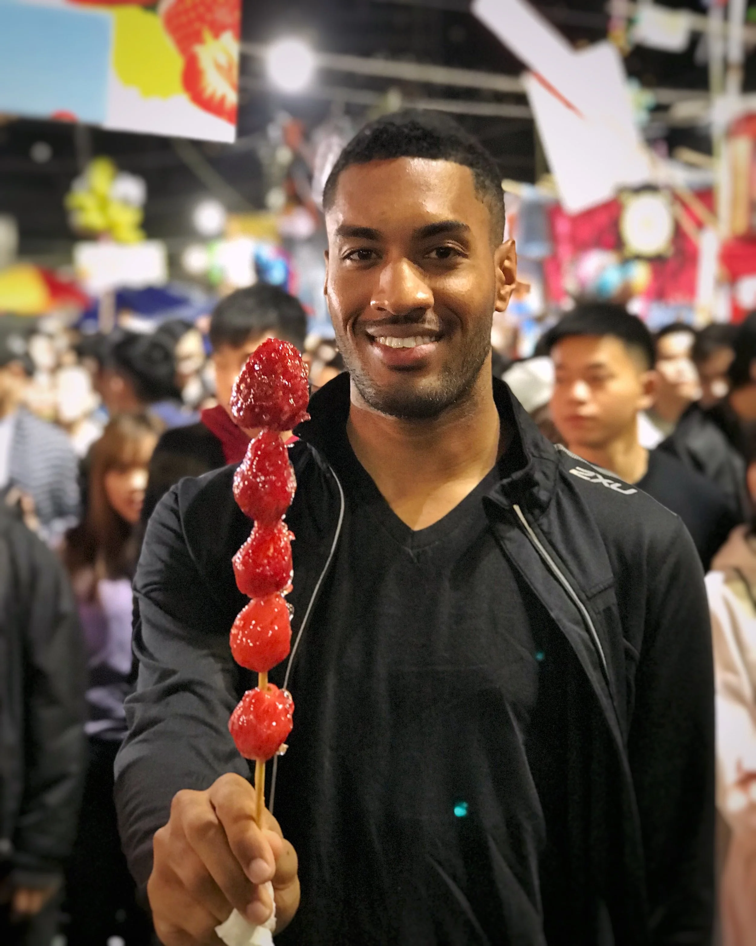 Celebrating the Year of the Dog with frozen candied strawberries at the Lunar New Year Market.