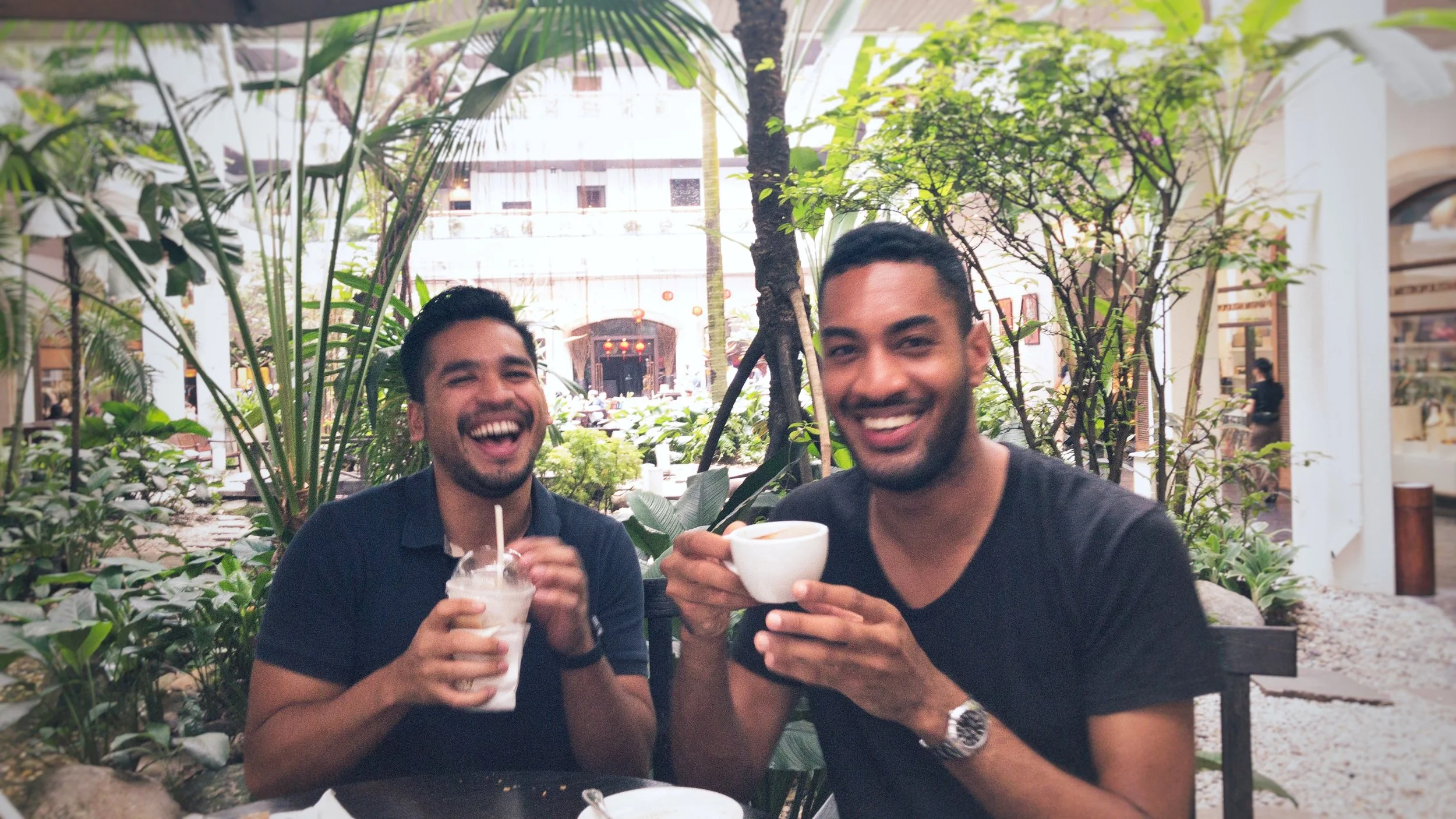 Vicool and me sharing a laugh over coffee in Bangkok.
