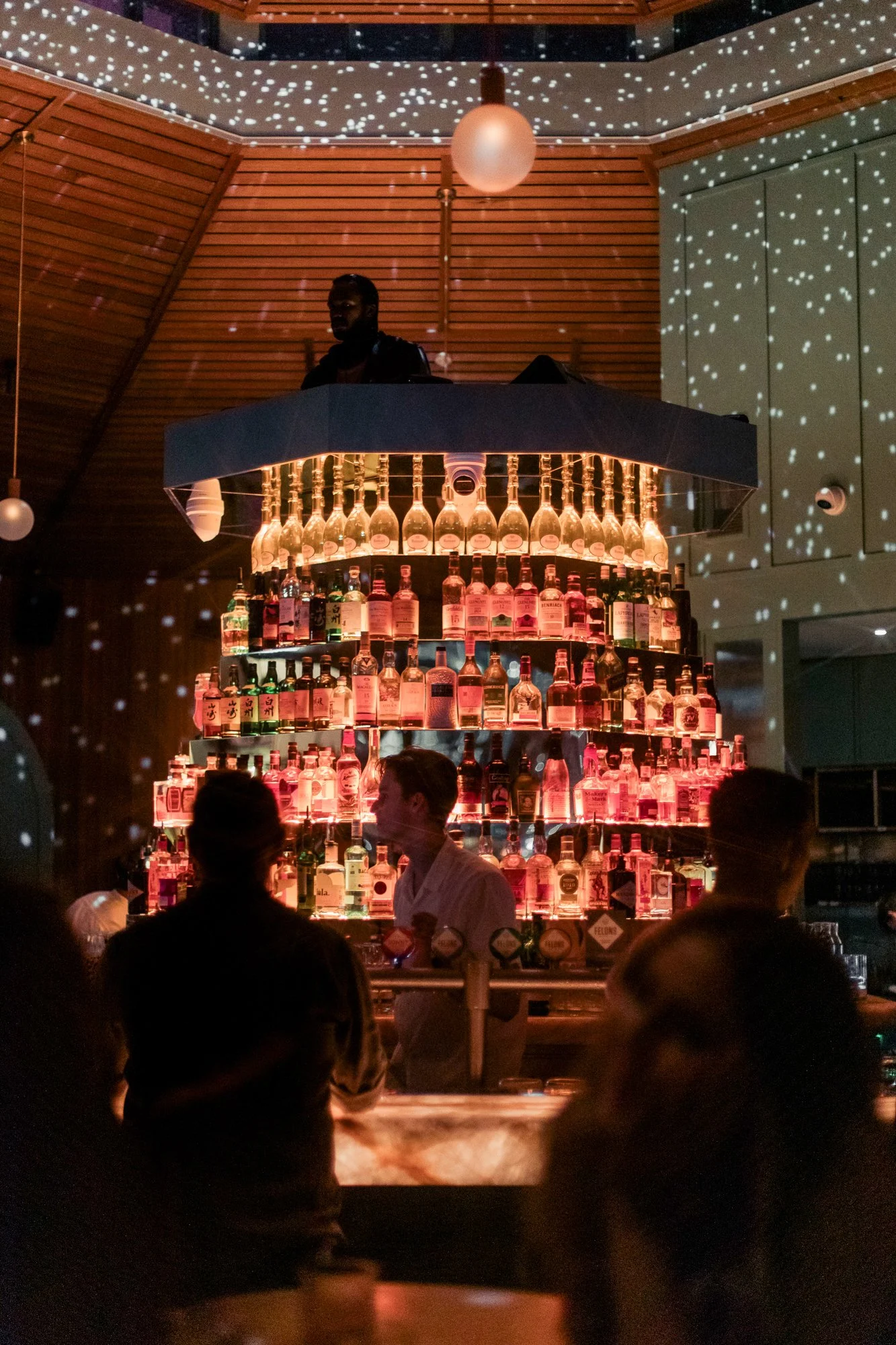 Mr Percival's lit up over the river at night