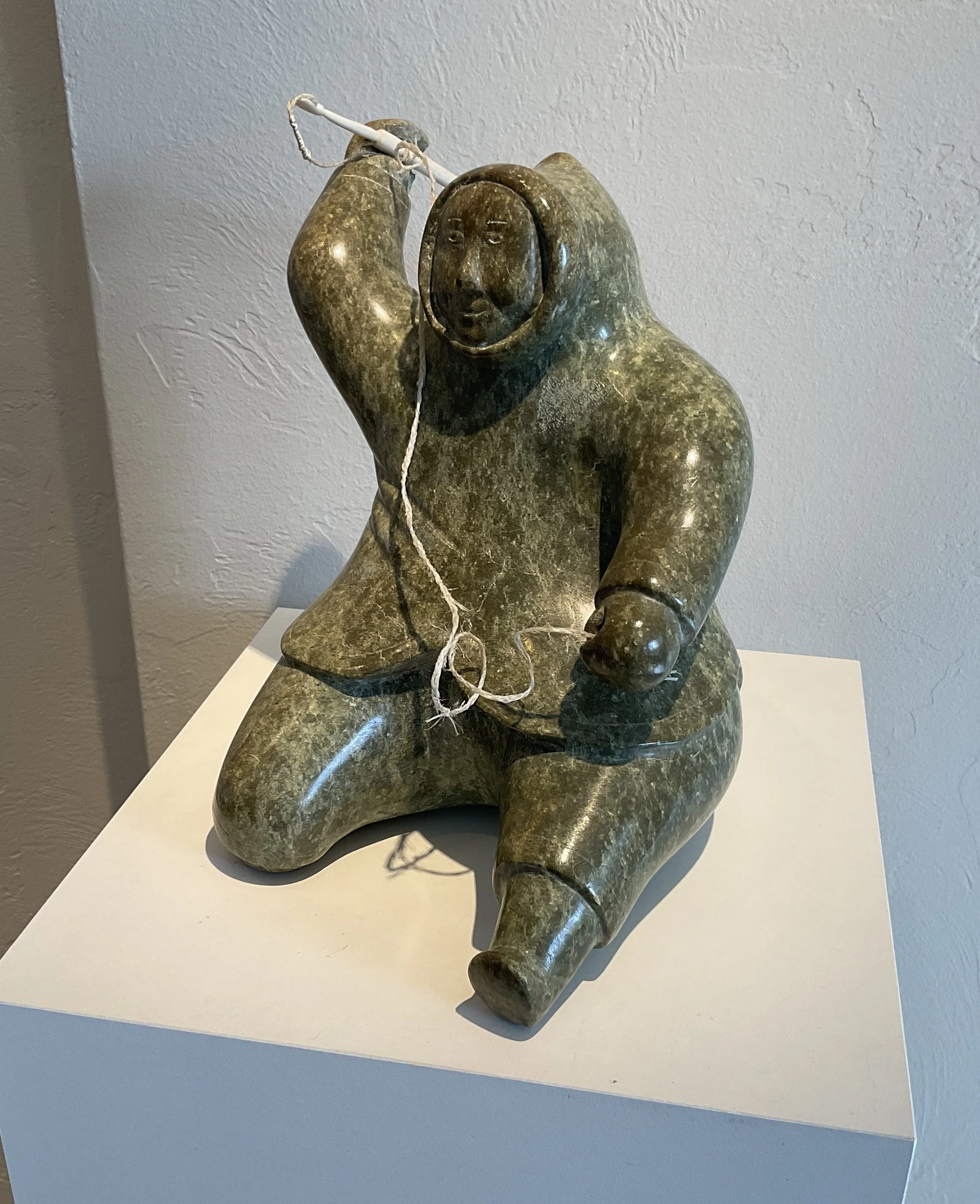 George Pitsiulak (b 1929 Kimmirut Canada) SEATED HUNTER (c 1965) 9.5 x 8 x 7 serpentine stone PRICE ON REQUEST