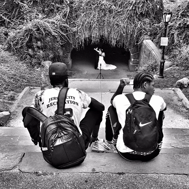Two guys in cental park watching bride and groom reduced.jpg
