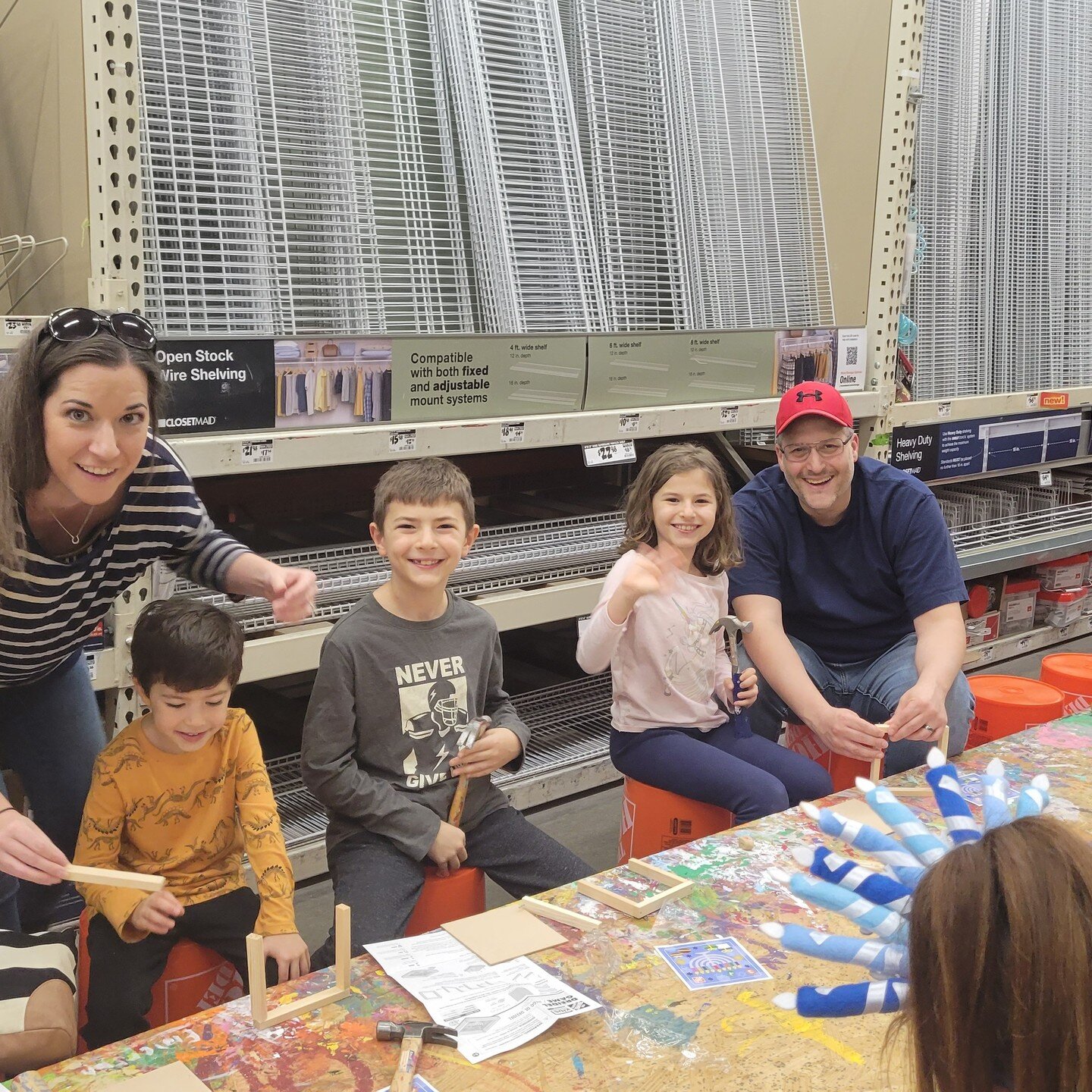 I'm sure you don't think of Chanukah when hearing the words Home Depot, or maybe now you do after attending our annual Chanukah Workshop at the Home Depot in Cornelius. 

We got ready for Chanukah by making our own dreidel sets. The smiles and concen