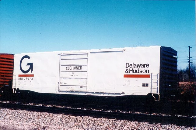 Under the Guilford reign, most of D&H's locomotives were repainted into the Grey and Orange scheme, or into the MEC Orange scheme, but only one D&H box car was ever painted in the 'Big G' scheme. 27073 is shown in pristine condition at Saratoga Springs in March 1983. Photo from a Bill Mischler 35mm slide, used by permission.