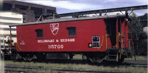 D&H 35700 The first in the series and the last in service. Sans cupola, the car is seen in new Spartan lettering with a gray roof at Colonie in July, 1981. Photo by Tony Hodun.