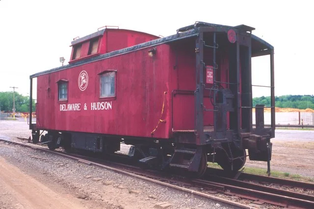 D&H 35706 Notice the strange circular herald on this caboose and the lack of any number on the side. Port of Albany, NY approximately 2001. Photo by Chris Shepherd.