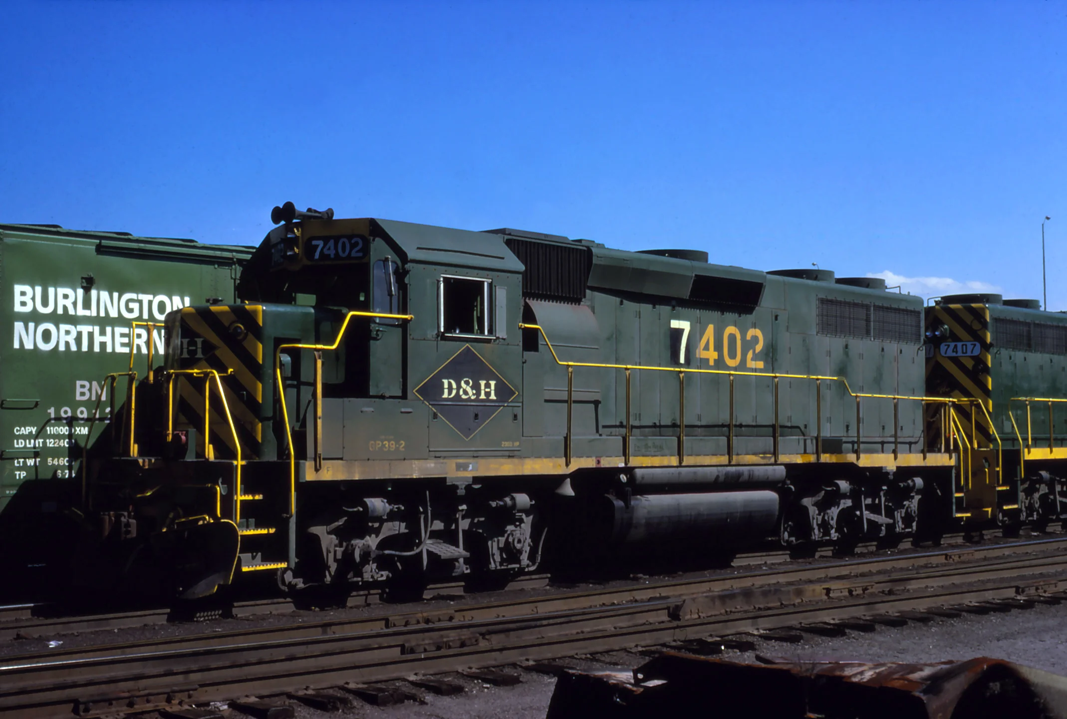 D&H GP39-2 #7402 lays over in Binghamton, NY on July 22, 1976. The Garbely Publishing Company collection