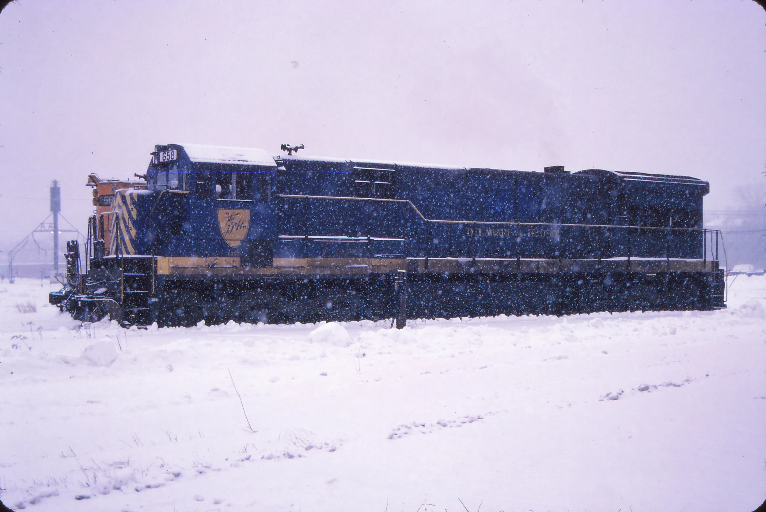 In December of 1987, D&H U33C 758 has been renumbered to 658 by Guilford, but still wears its coat of D&H blue. It was the only U33C to be so painted by the D&H. It is seen here in the former Maine Central Rigby Yard in Portland, ME. Brian E. Loss photo, The Garbely Publishing Company collection