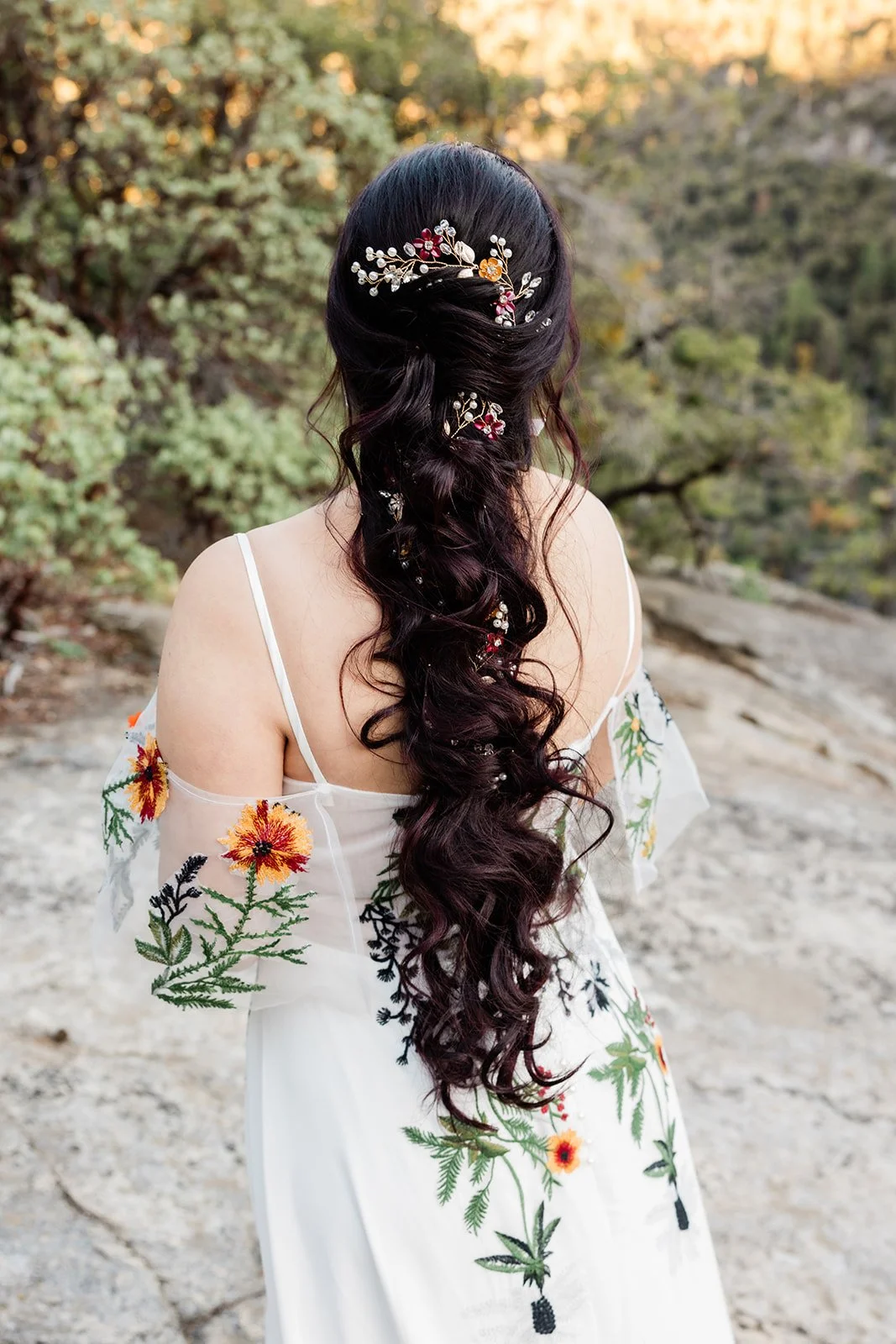 Long Down Hairstyle with Curls and Flowers Photo by www.jenniferwhalenweddings.com