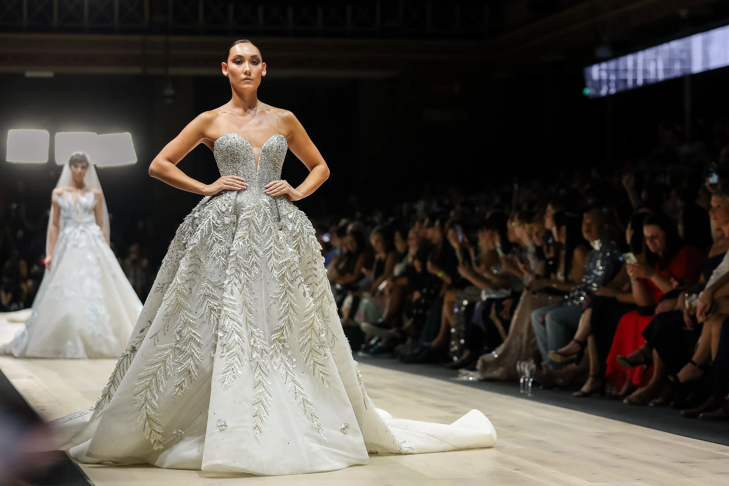 Event photography capturing a bridal fashion runway show in Melbourne with guests watching from the audience during Melbourne Fashion Week