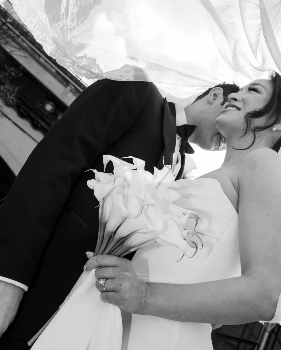 Black tie, calla lilies, veil in the air &mdash; and that just-married kiss with everyone cheering 🤍
From the ceremony to the reception at The Sanderson, it was pure elegance with a little after-dark energy.

Sydney wedding photography &bull; modern