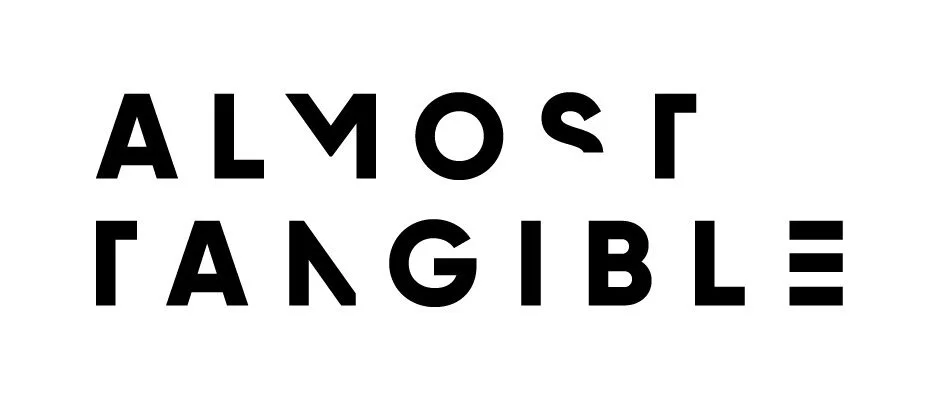 Almost-Tangible_Logo_Reverse_AW_Cropped.jpeg
