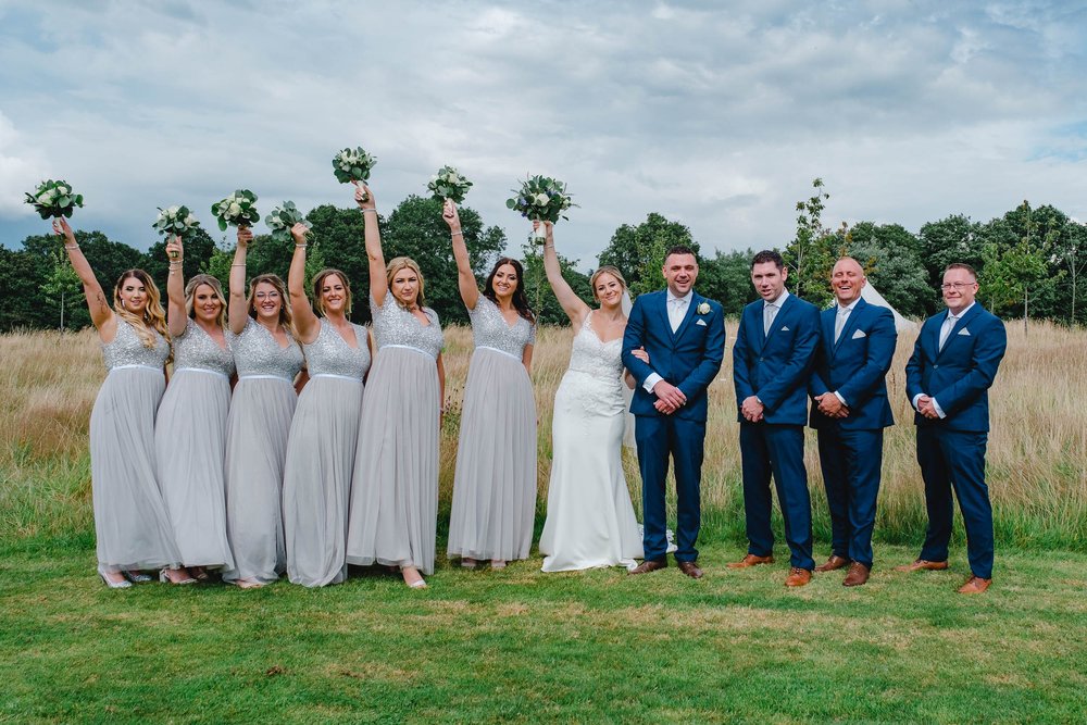 Bridesmaids in silver and sequin dresses