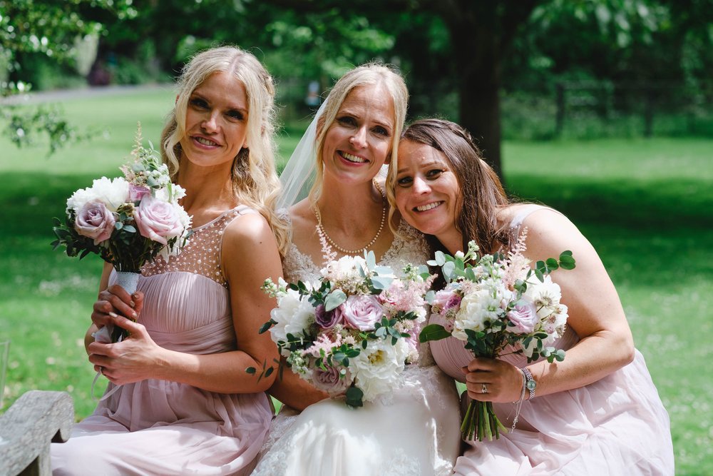 Bridesmaids in blush pink dresses