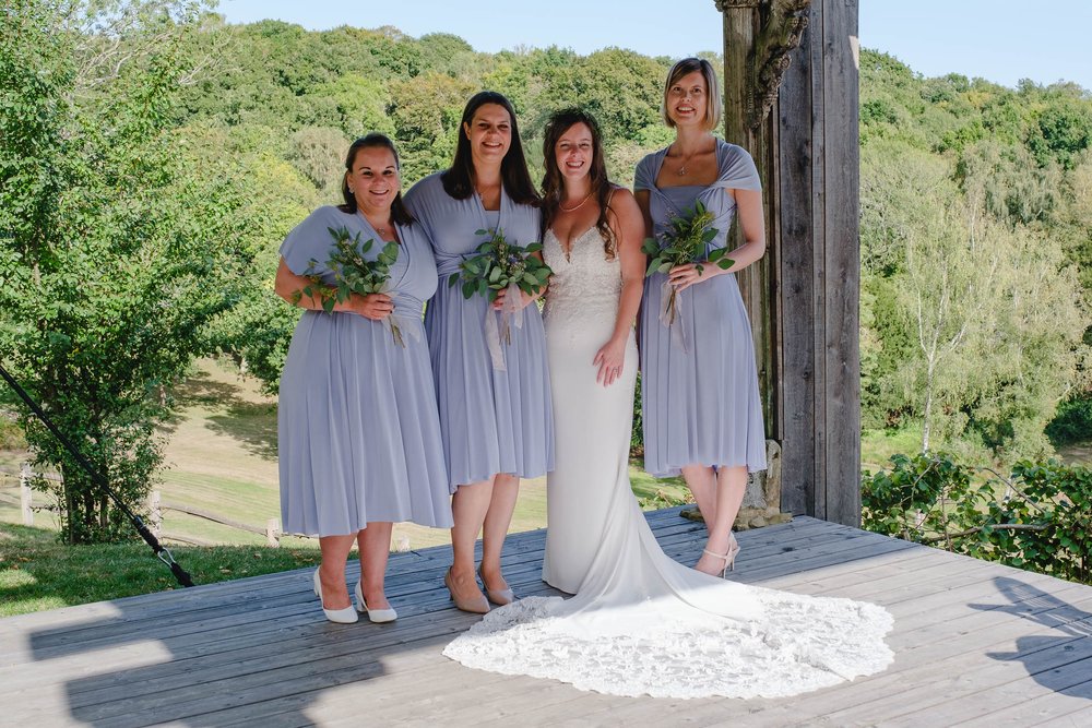 Bridesmaids in pale blue dresses