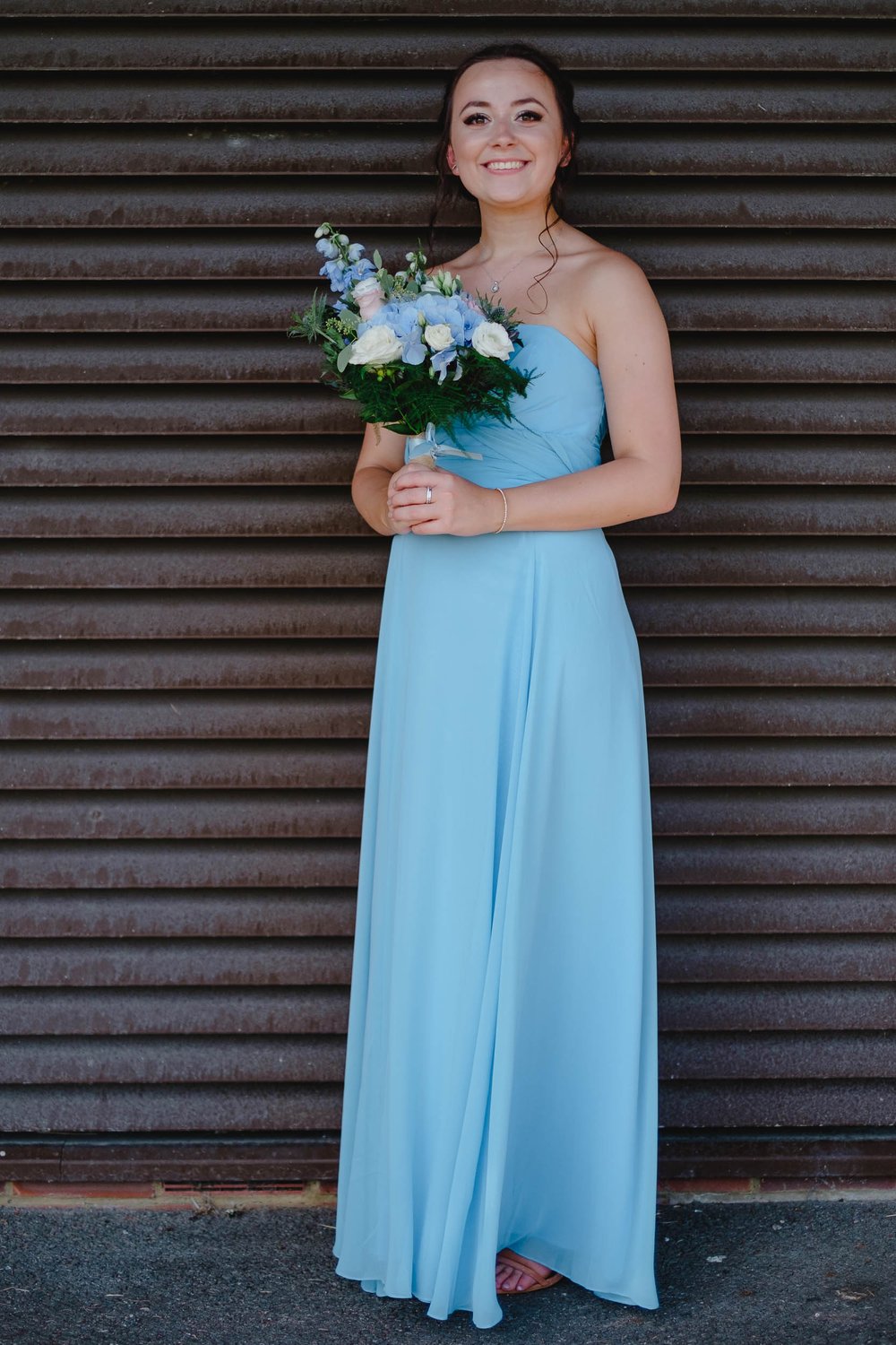 Bridesmaid in full length baby blue dress