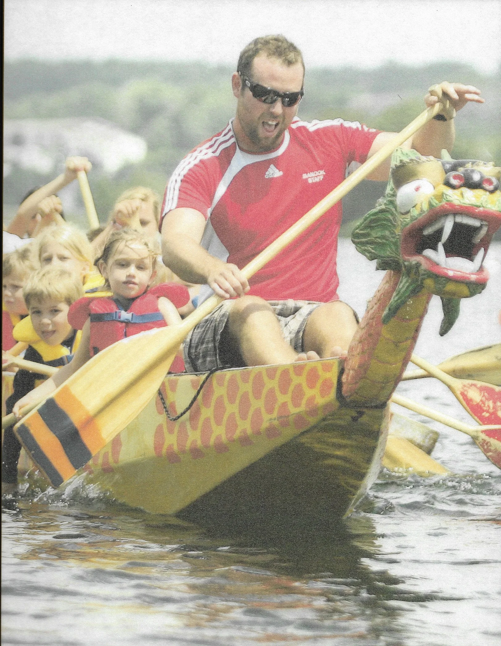 Joe Starr, stroking a dragon boat full of young paddlers.