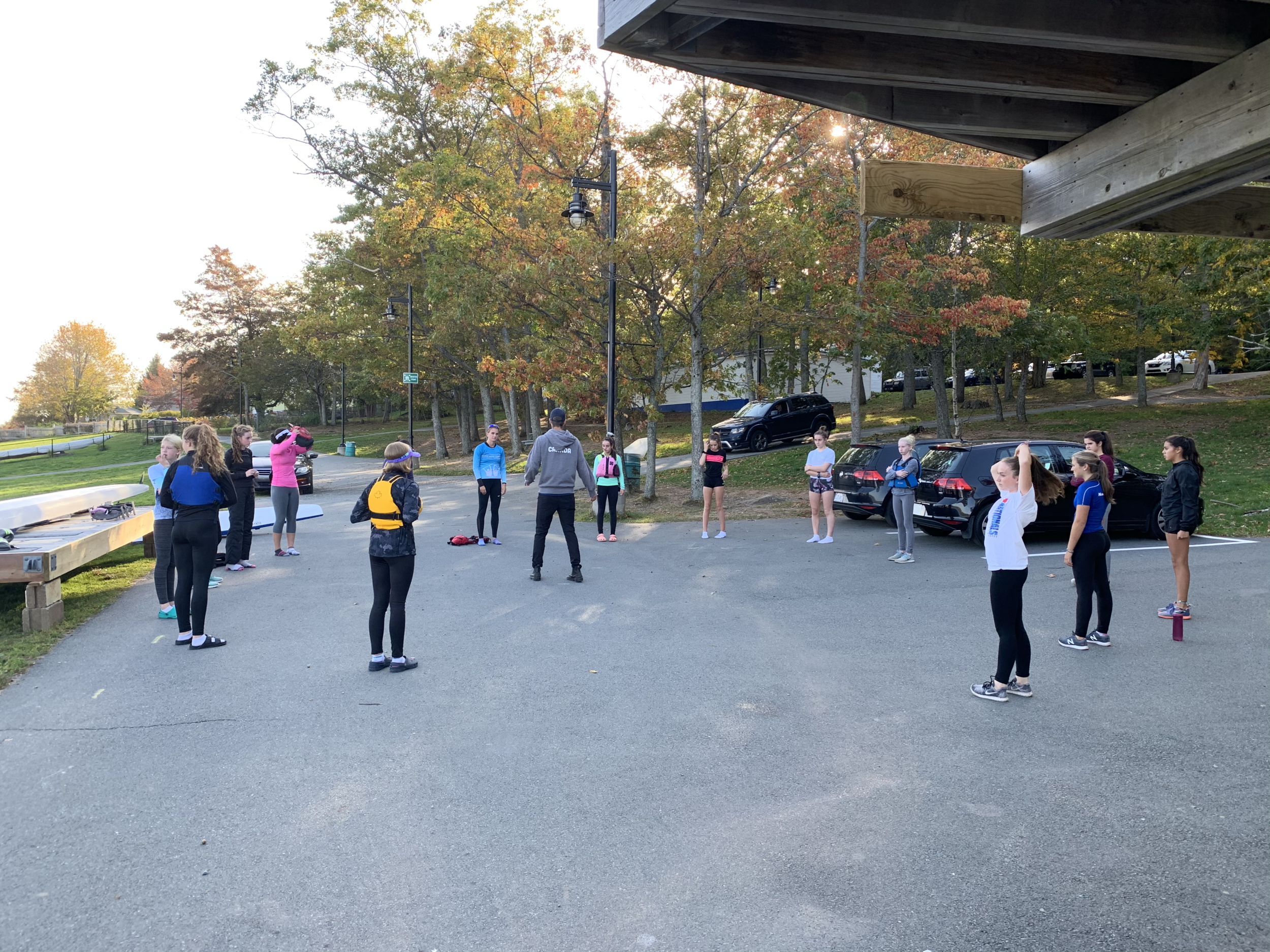 Jake Jeannot, ADCKC’s Sports Excellence Lead, runs a on land warmup with Team Atlantic U14 Women Kayak/Canoe.