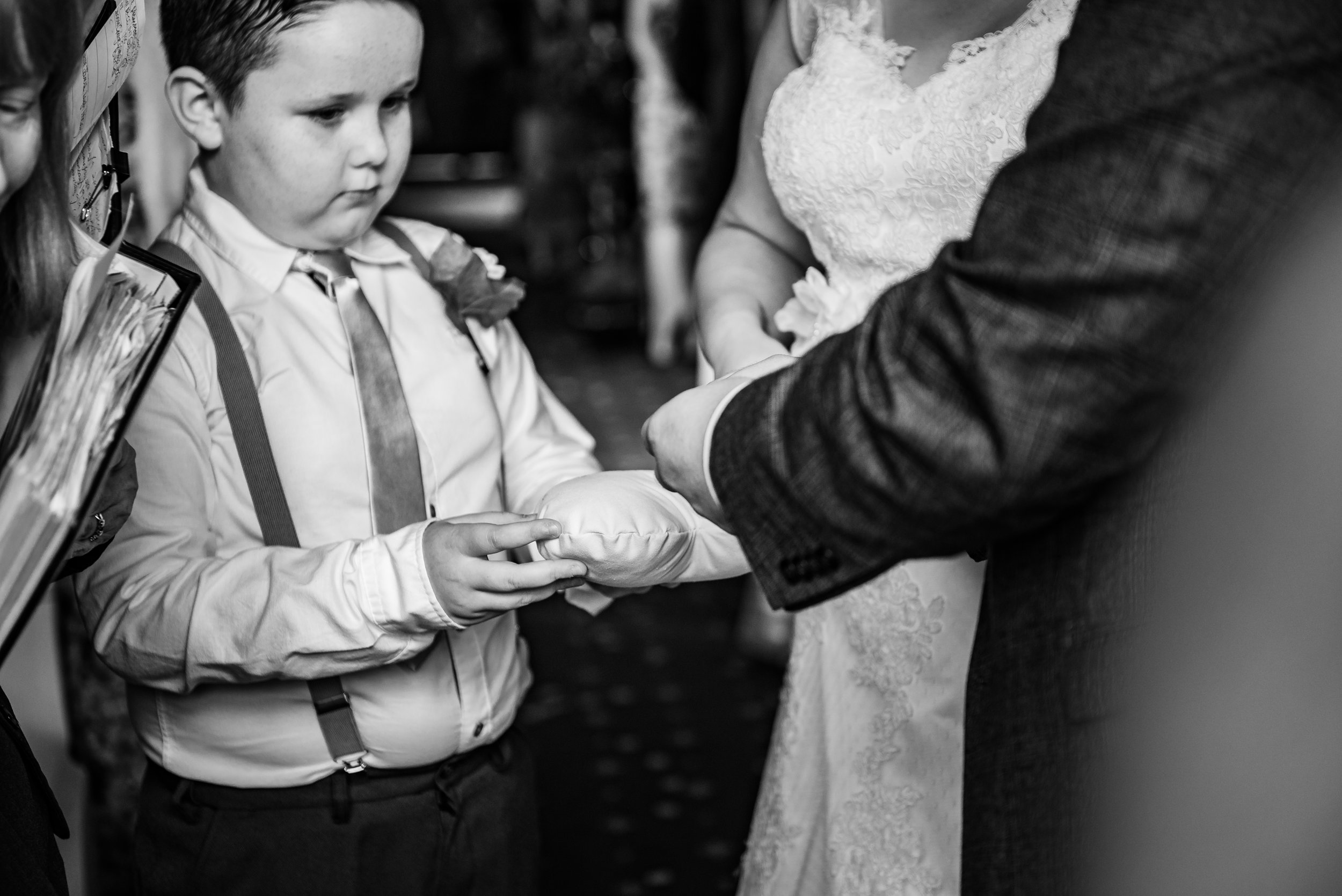 black and white wedding photography ring bearer