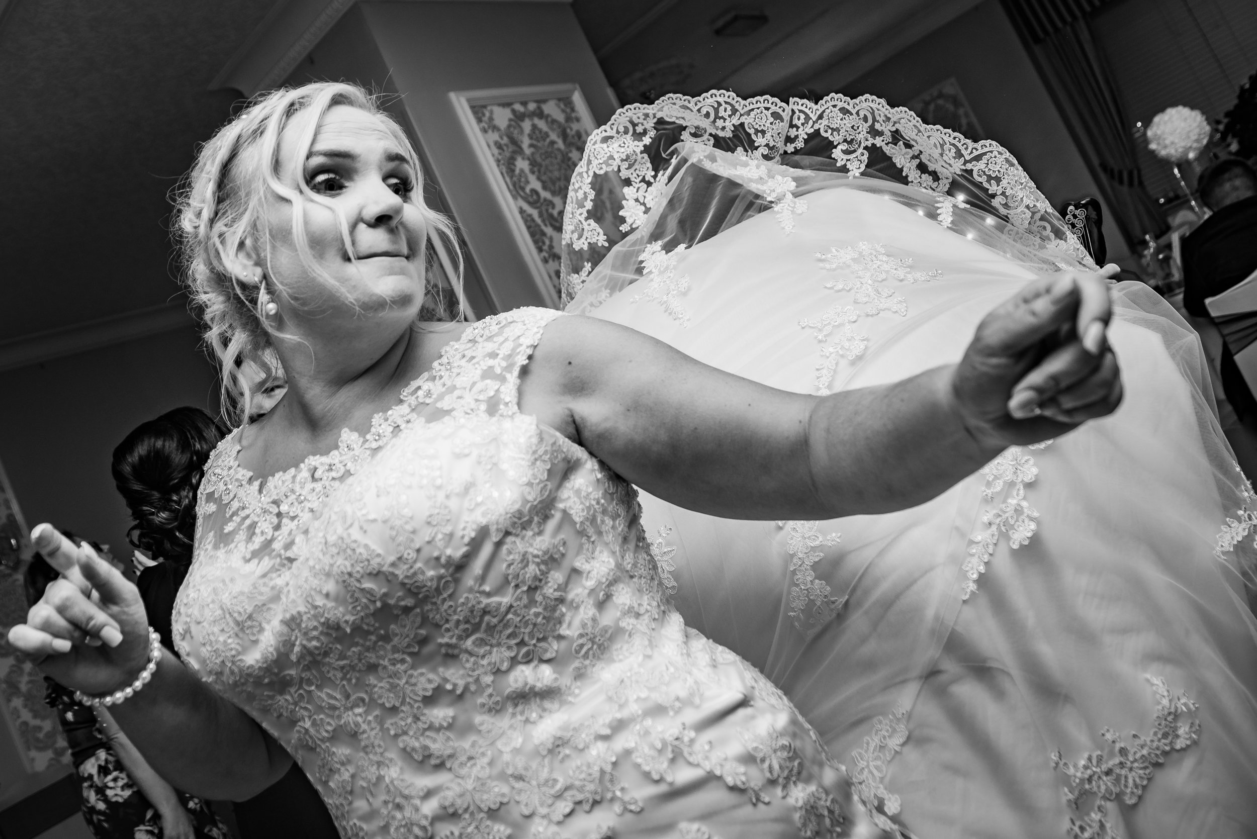 black and white wedding photography bride enjoying herself