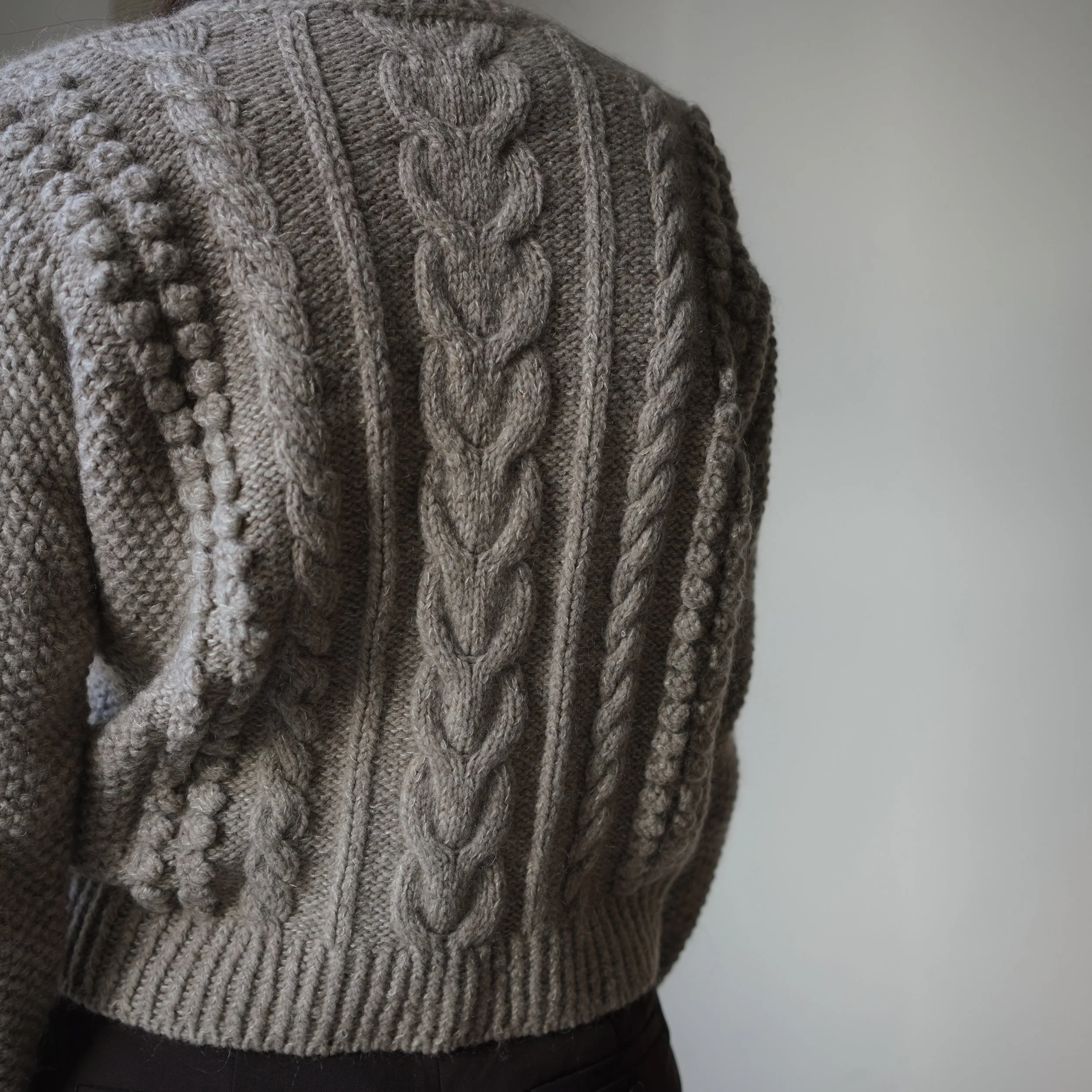 Cables, bobbles, and lots of love. That&rsquo;s what went into making the Poppea Cardigan! It also features my signature sleeve cable, which you might also recognize from the Beatrix Cardigan and Philomena Sweater.

This version is knitted in La Rinc