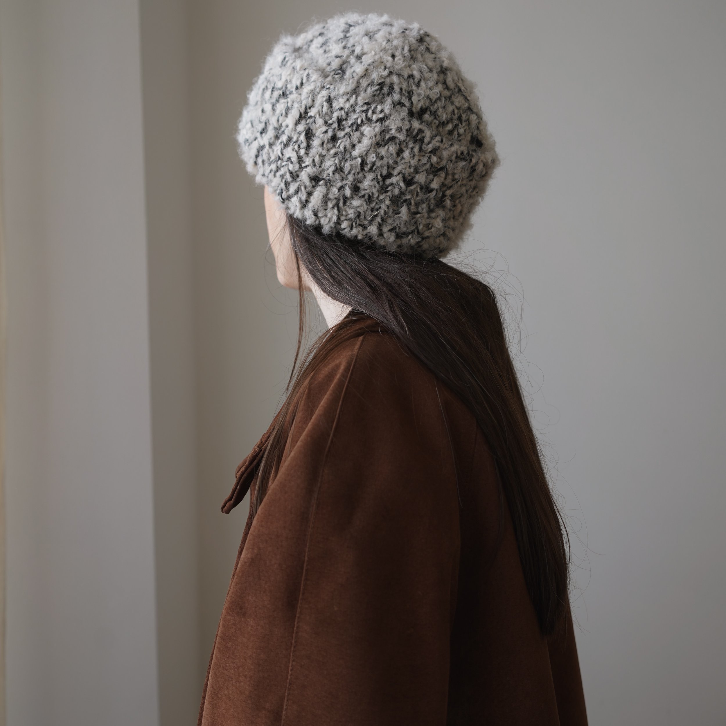 Pattern Release: The Sini Beanie. 

I designed this piece to capture the rustic soul of thick, undyed handspun wool, using yarns that are easy to find. Three distinct textures, held as one, creating a dense and structured fabric that holds its shape 