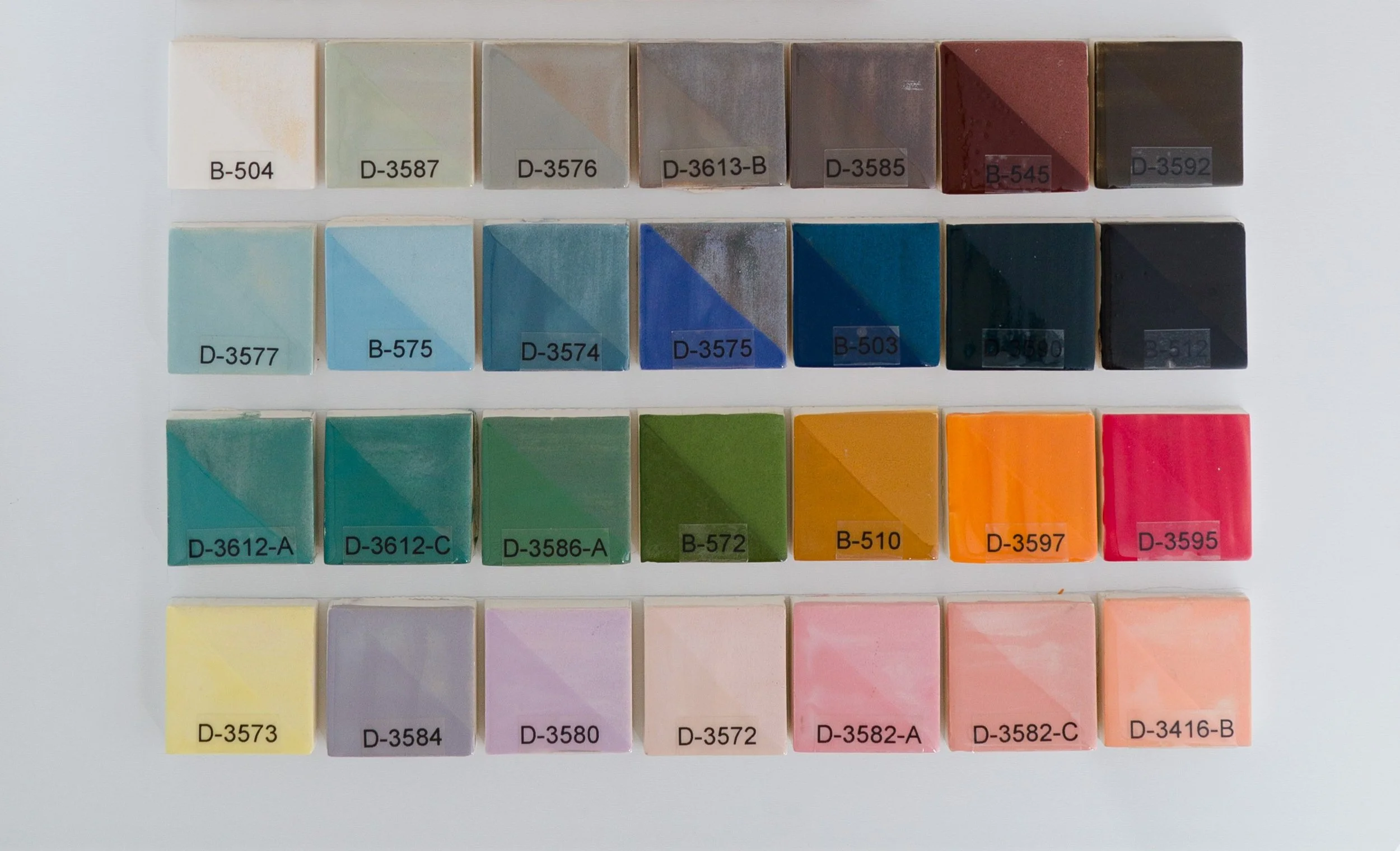 Sample display board showing Underglazes fired at Cone 05. Codes ranges include B-504 to D-3416-B.