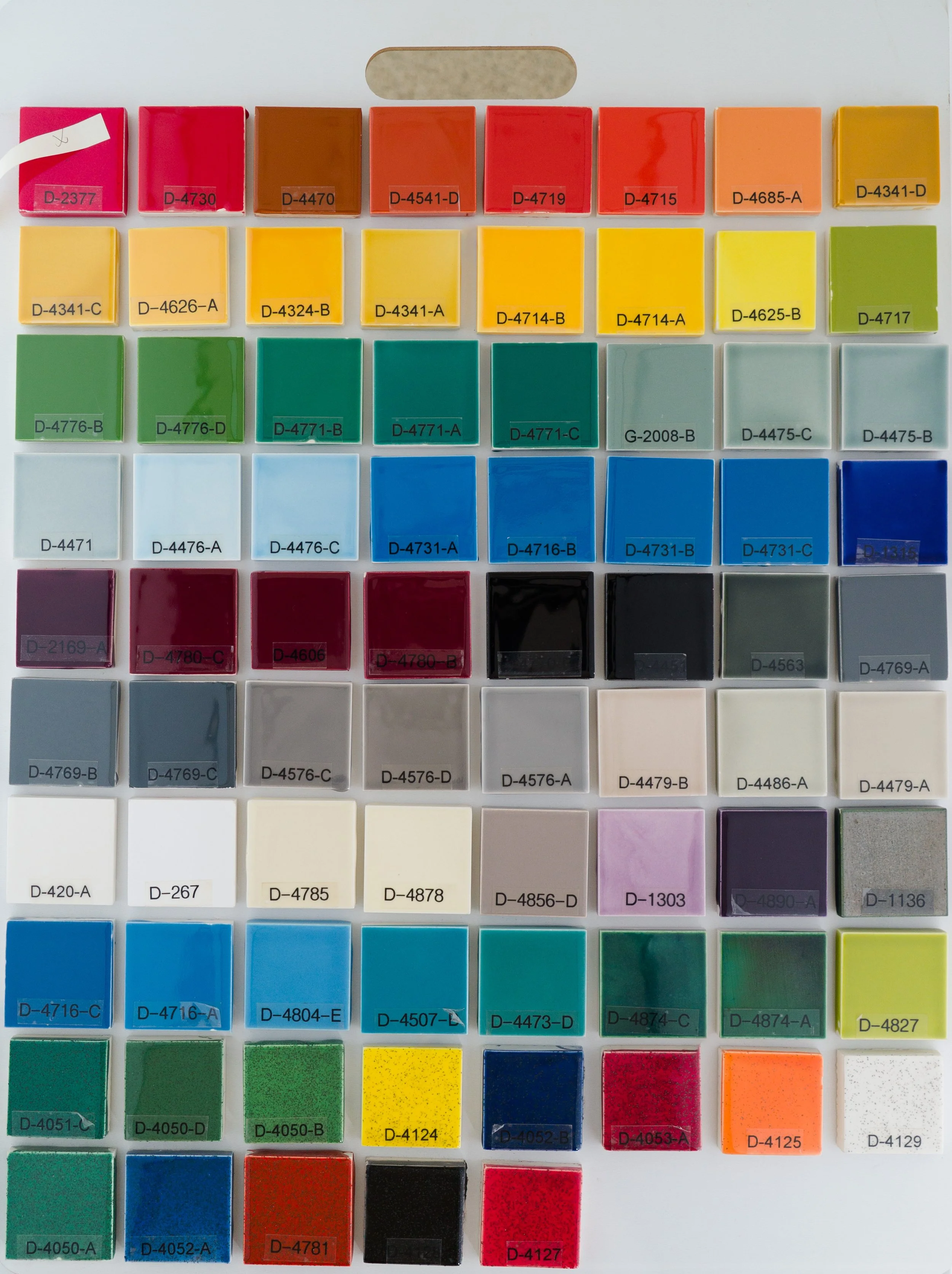 Sample display board 5 showing Gloss Glazes fired on Standard Bisque body at Cone 05. Codes ranges include D-2377 to D-4127.