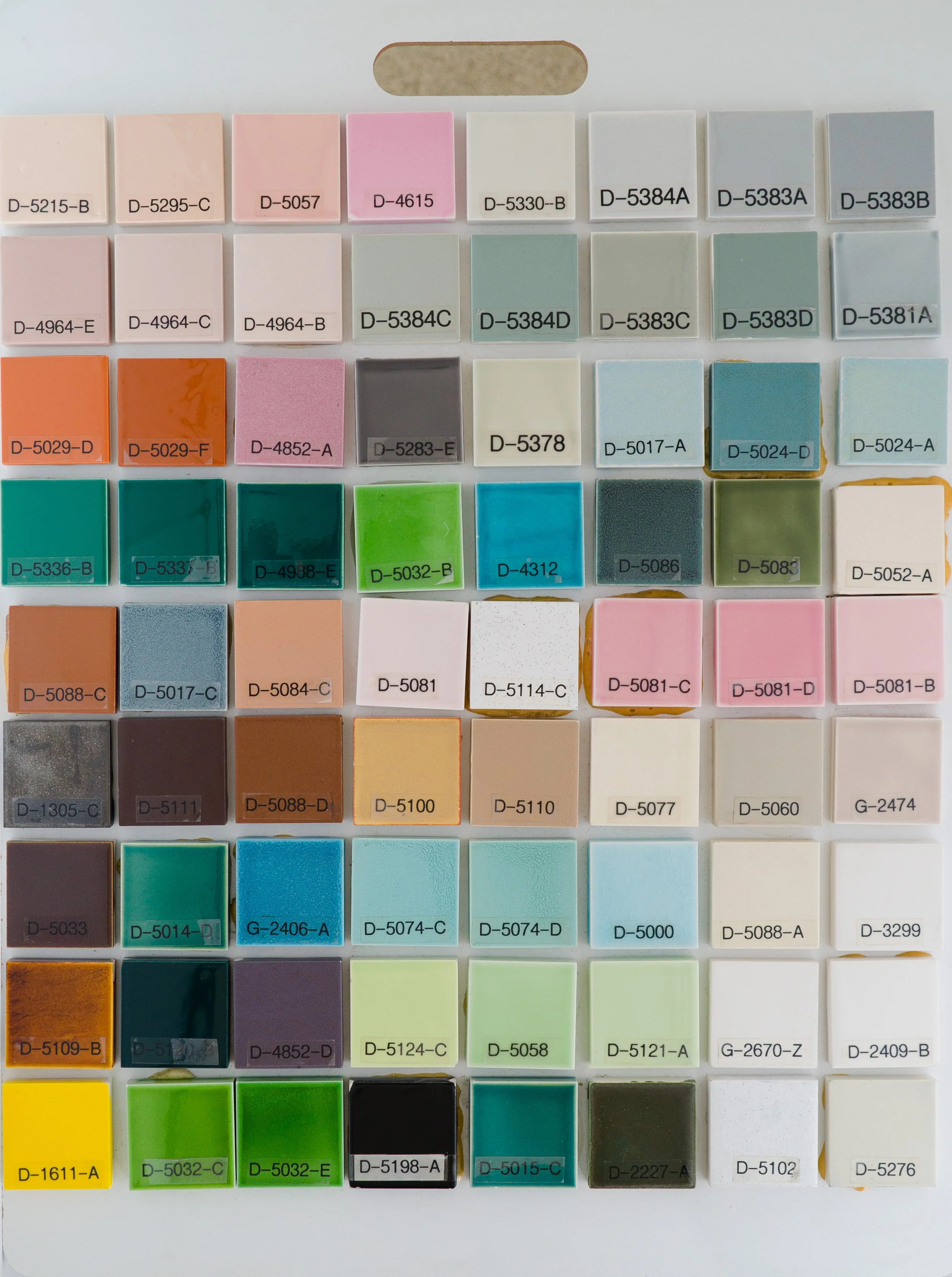 Sample display board 8 showing Gloss Glazes fired on Standard Bisque body at Cone 05. Codes ranges include D-5215-B to D-5276.