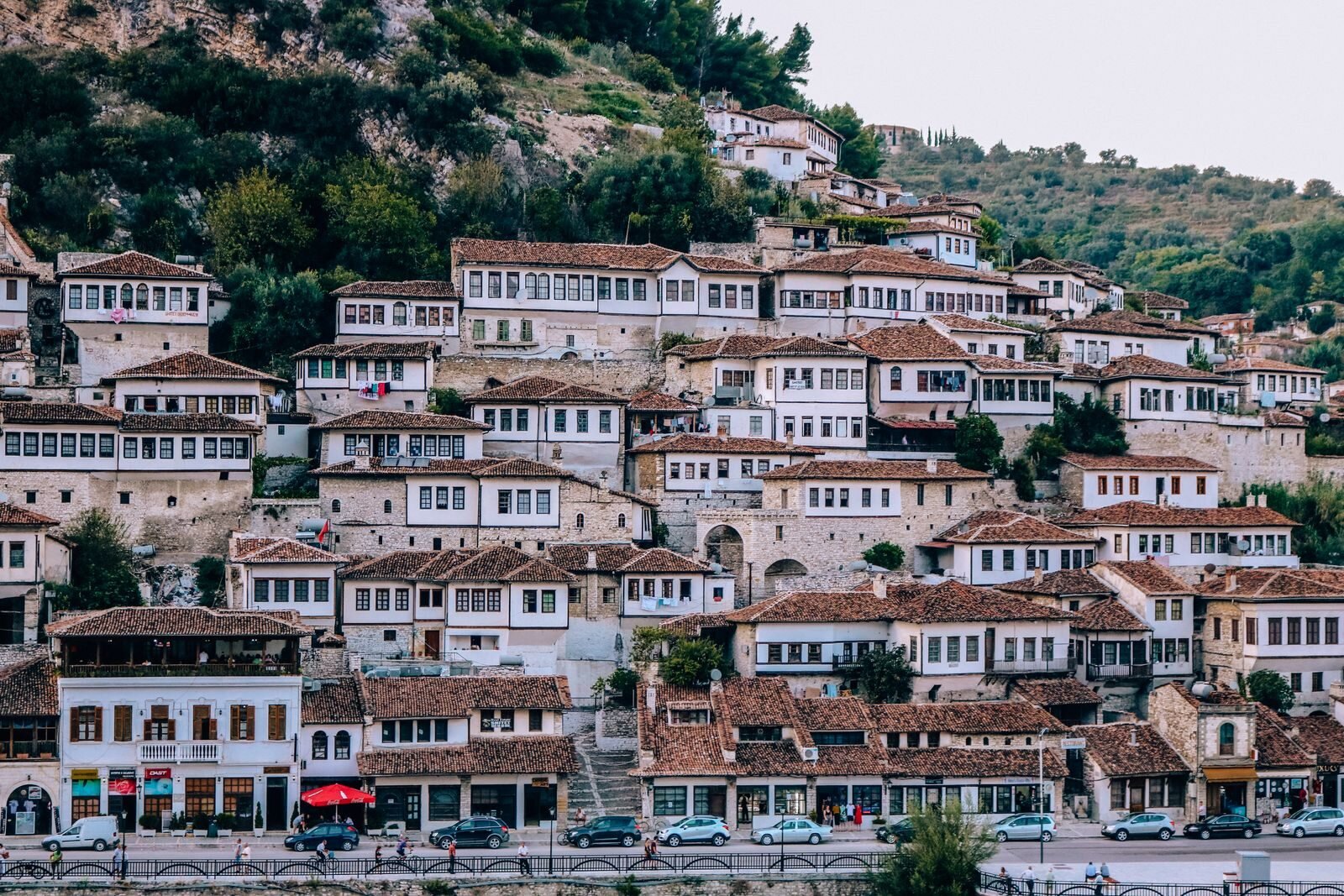 many white houses with big windows on the hillside