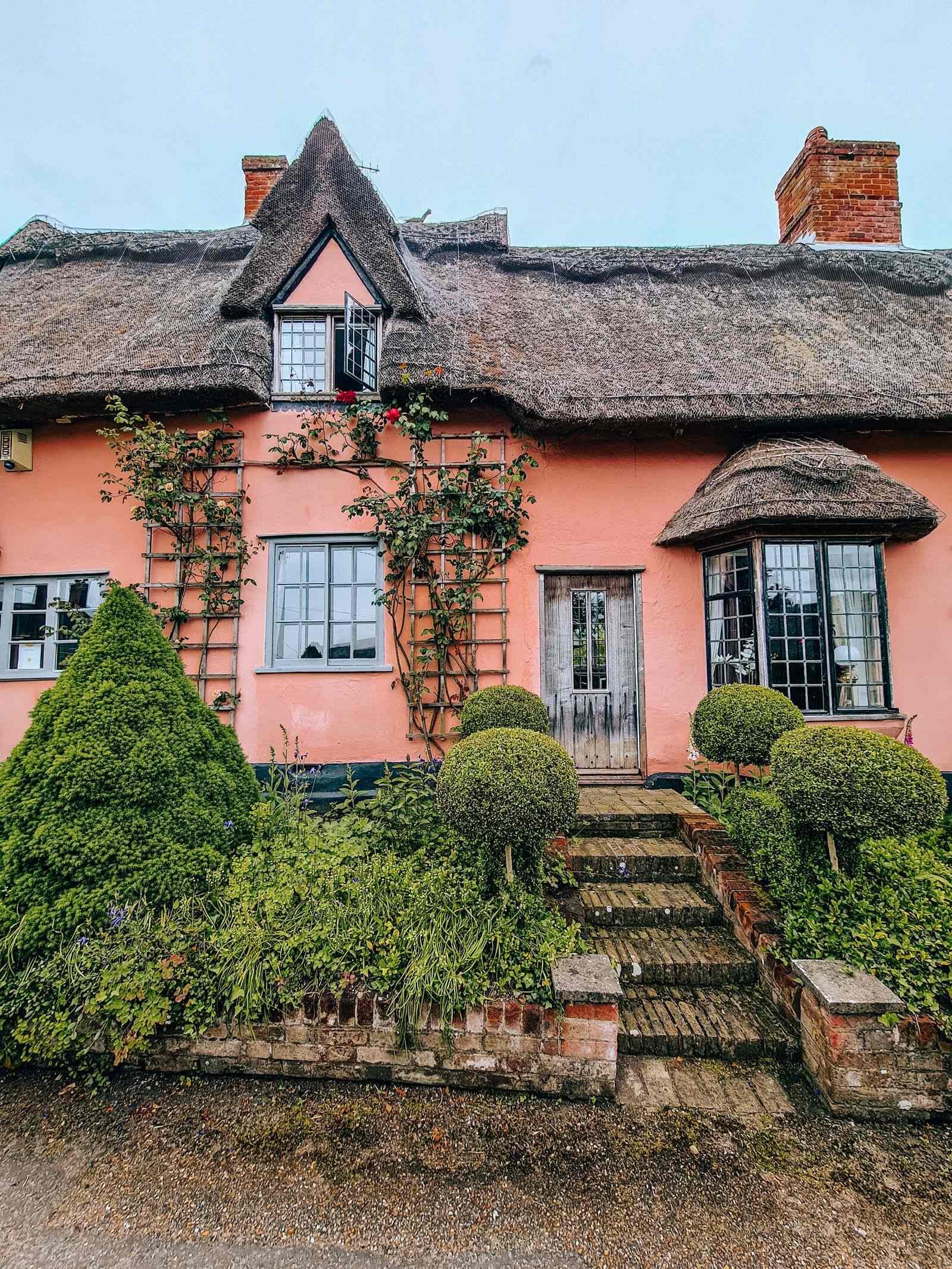 Kersey pink thatched cottage