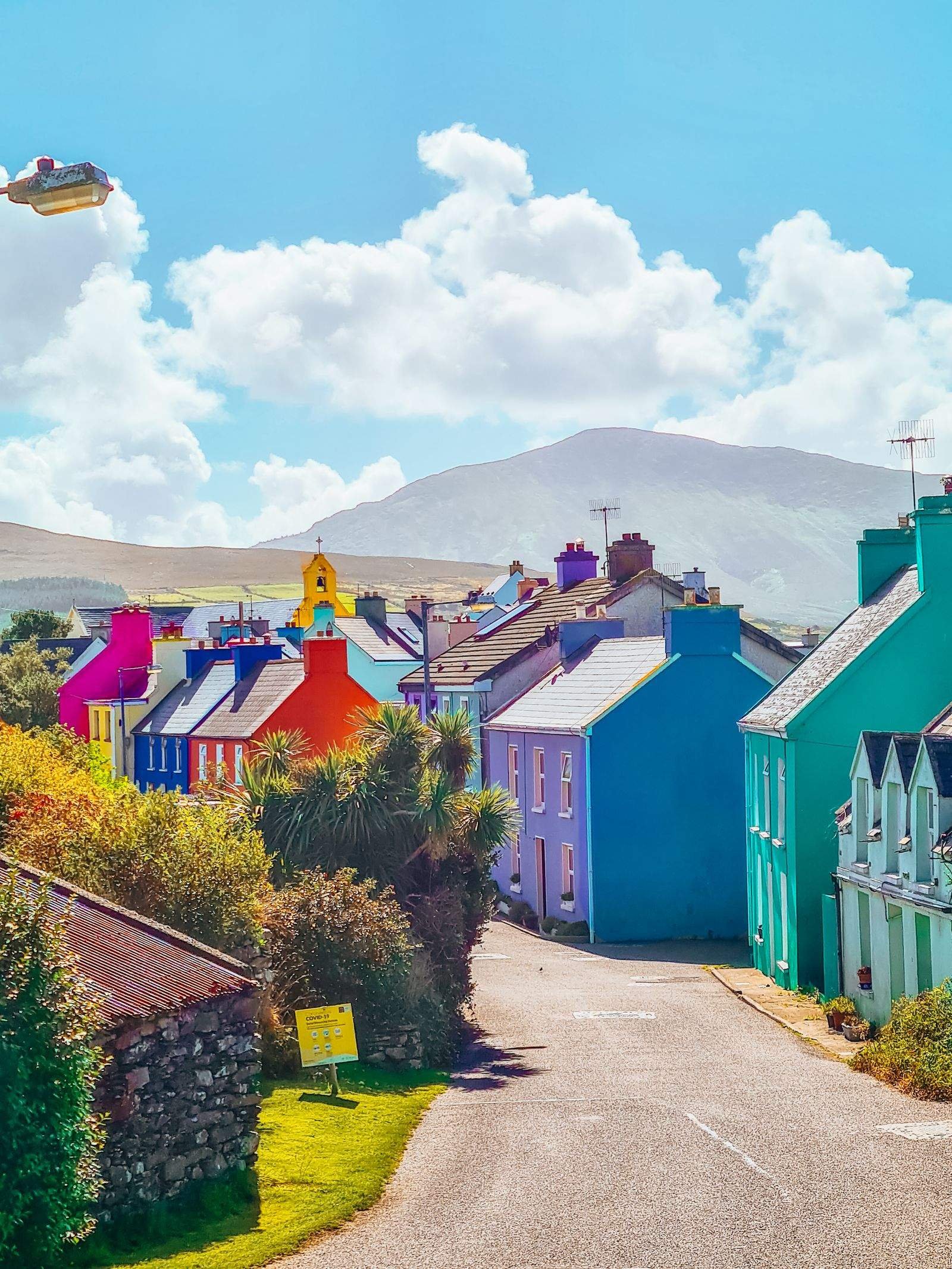  A road leading the many colourful buildings of Eyeries Village 