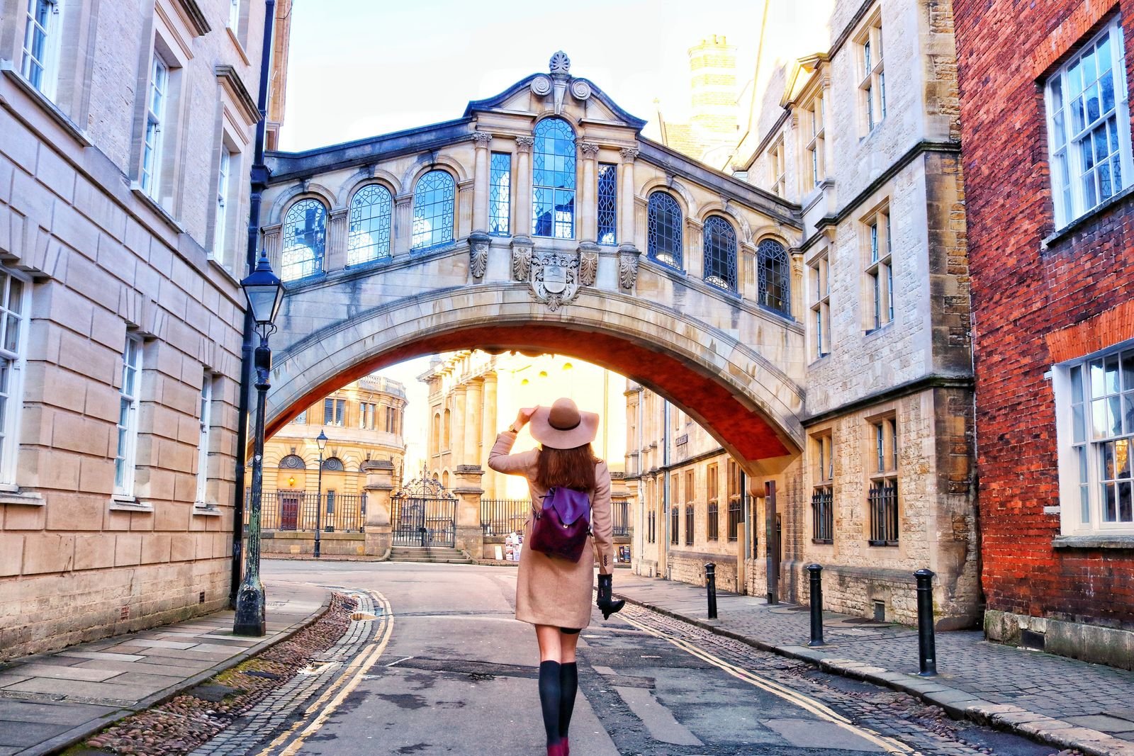 girl walking underneath the bridge of sighs in Oxford