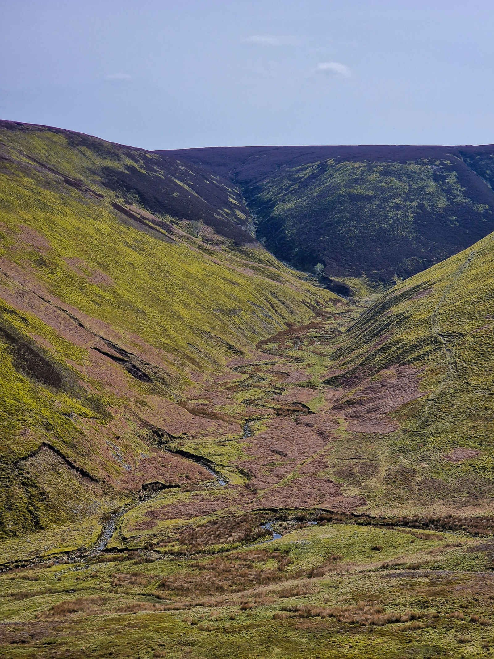looking down into a green valley with a river snaking through it - the trough of bowland