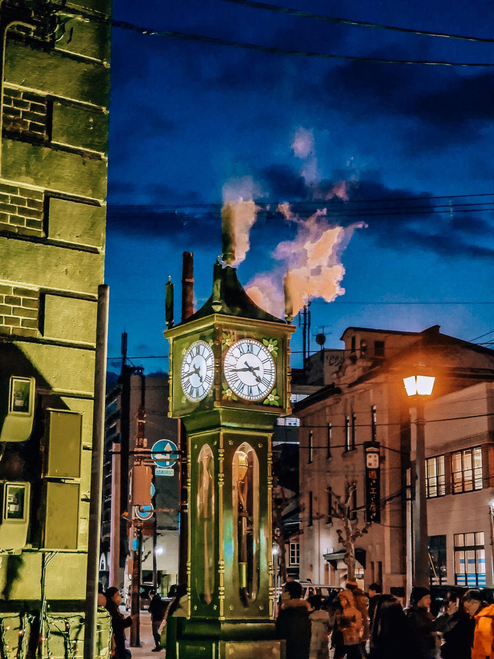 a 4-face grandfather clock which is a steam clock, steam coming out the top visible against the dark blue night sky