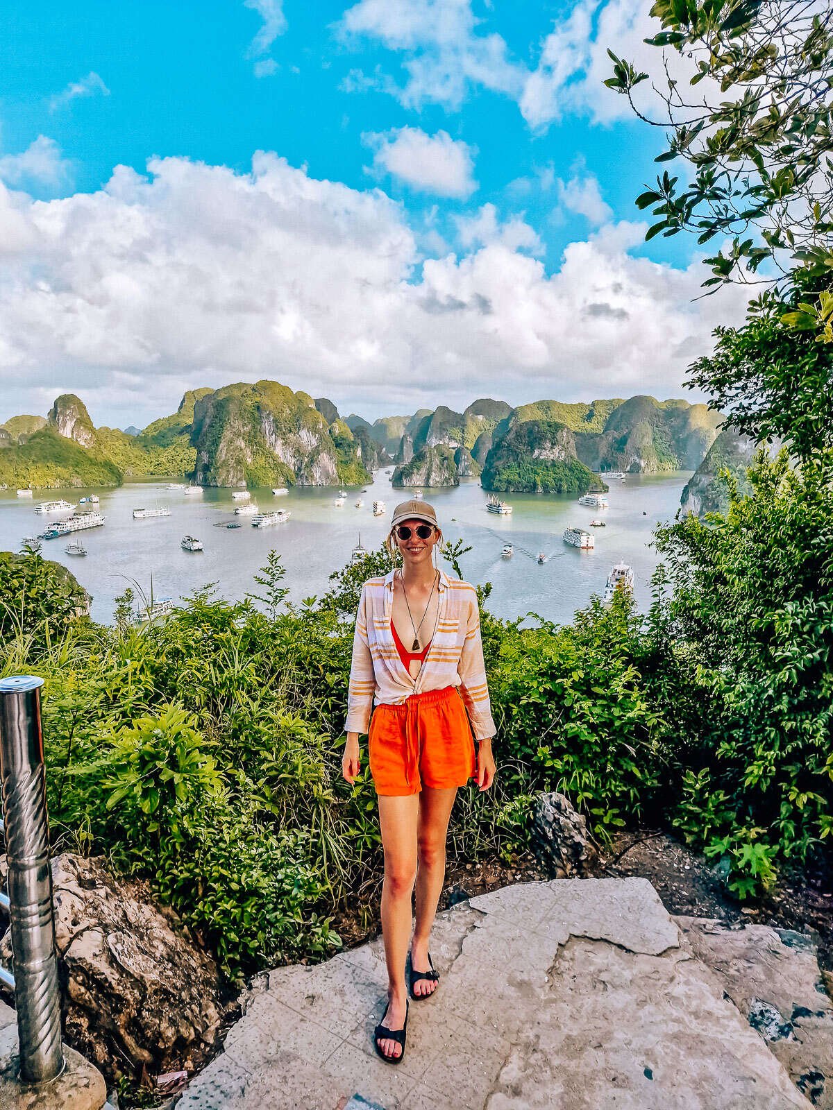 girl standing in front of a view of ha long bay from the viewpoint on ti top island