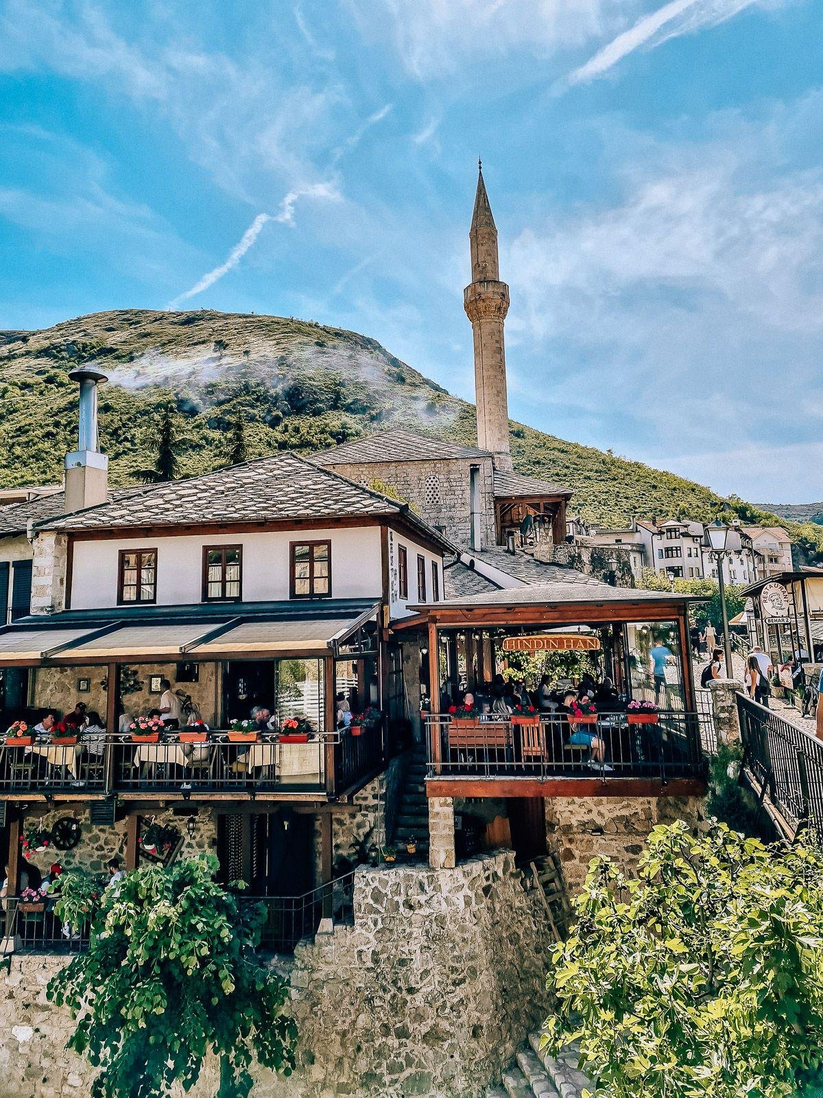 traditional Ottoman buildings and a minaret in old town Mostar, Bosnia