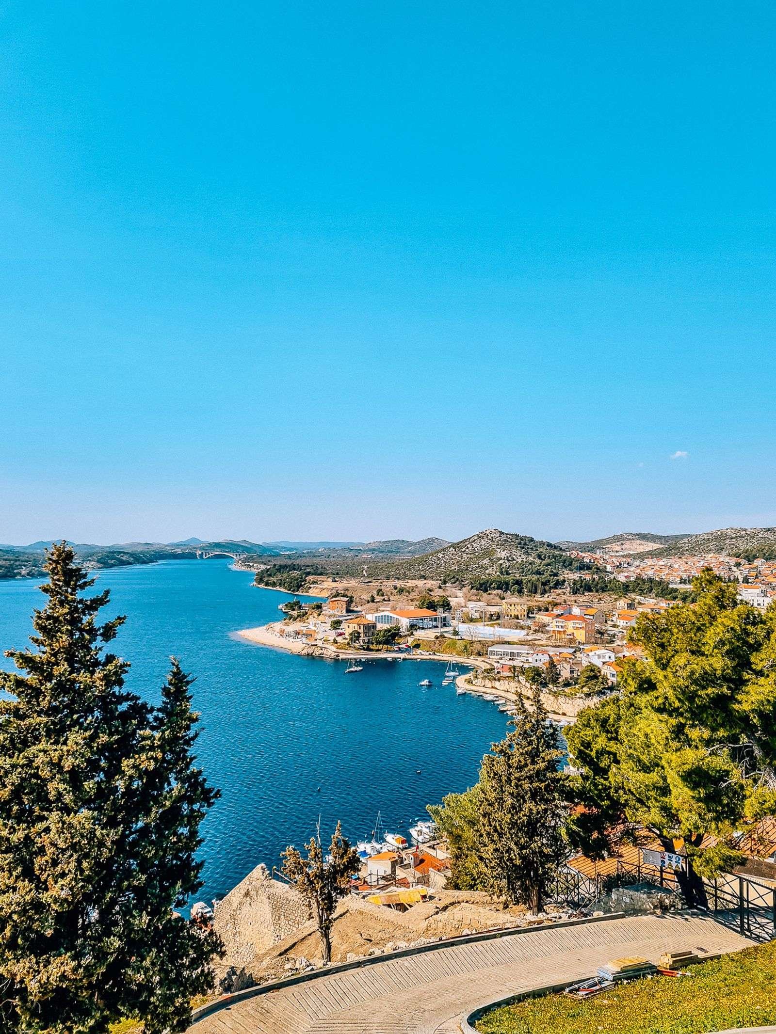 view from a hill, looking down on the coastline of Sibenik