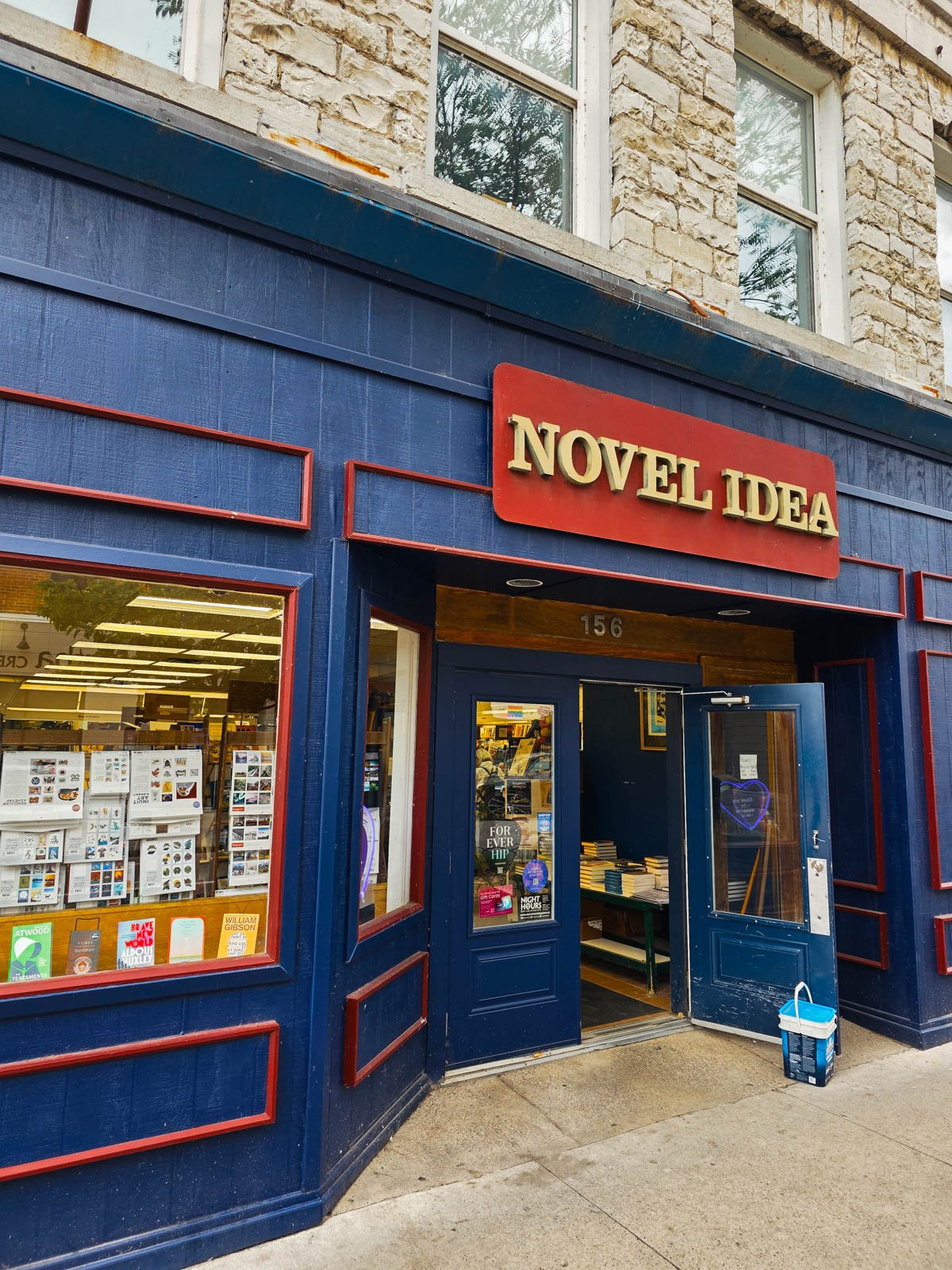 The blue and red front of a bookstore called Novel Idea in Kingston Ontario