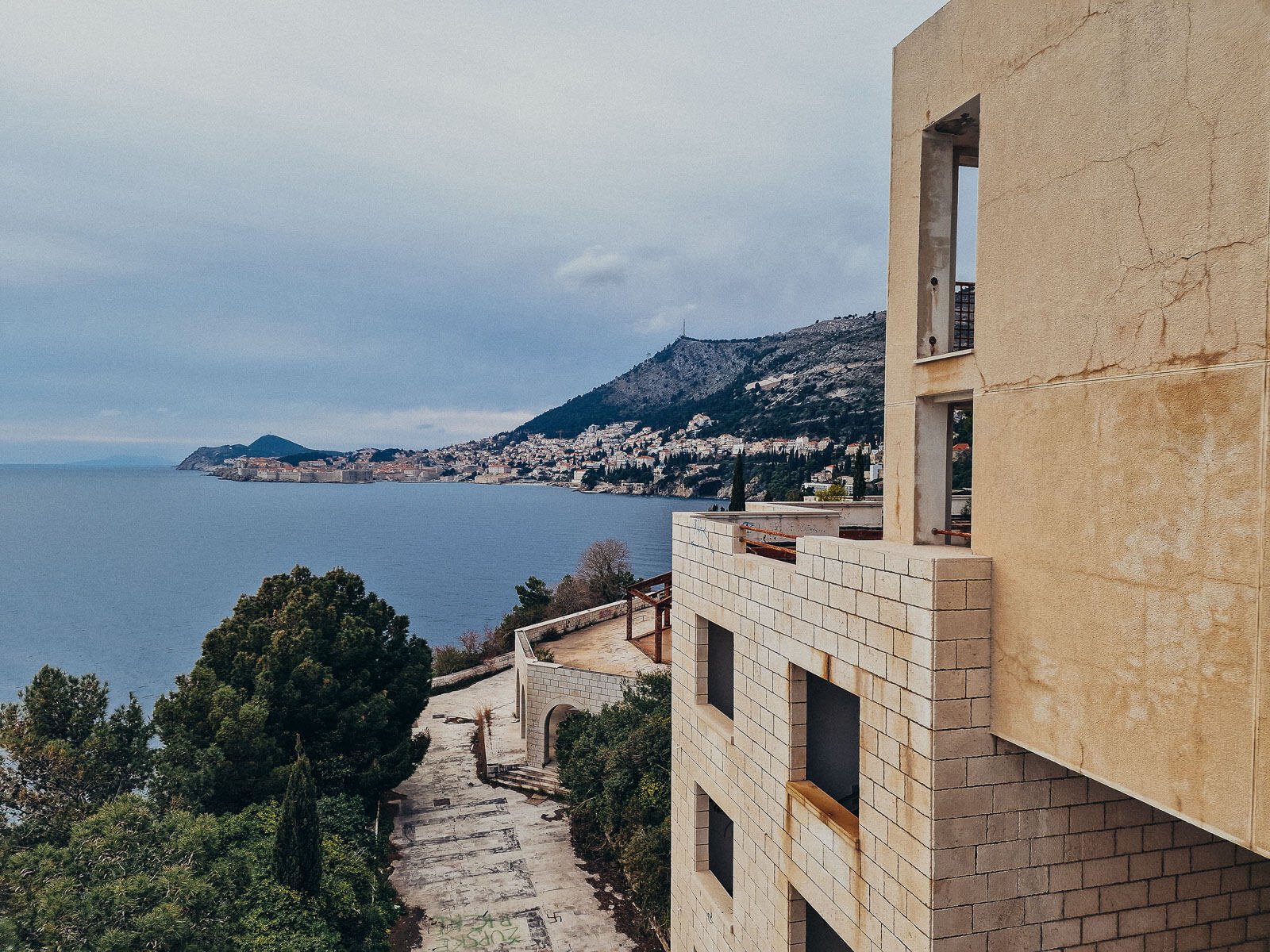 abandoned hotel building overlooking the bay of Dubrovnik