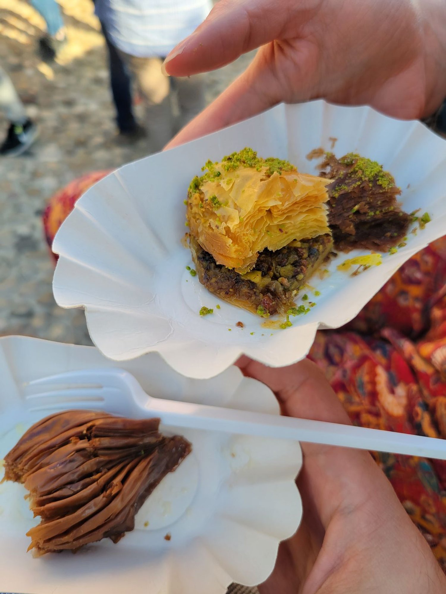 Two white plates with big pieces of Baklava