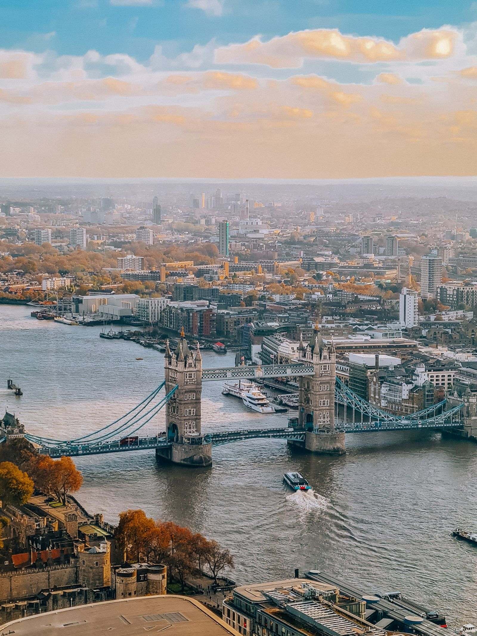 aerial view of Tower Bridge with London city beyond