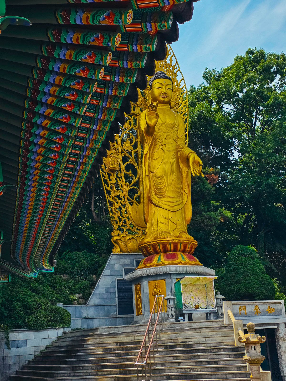 A large golden buddha statue at a temple