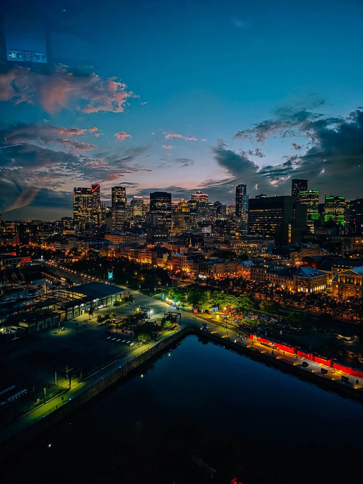 An aerial view from a ferris wheel of a sky skyline lit up at night